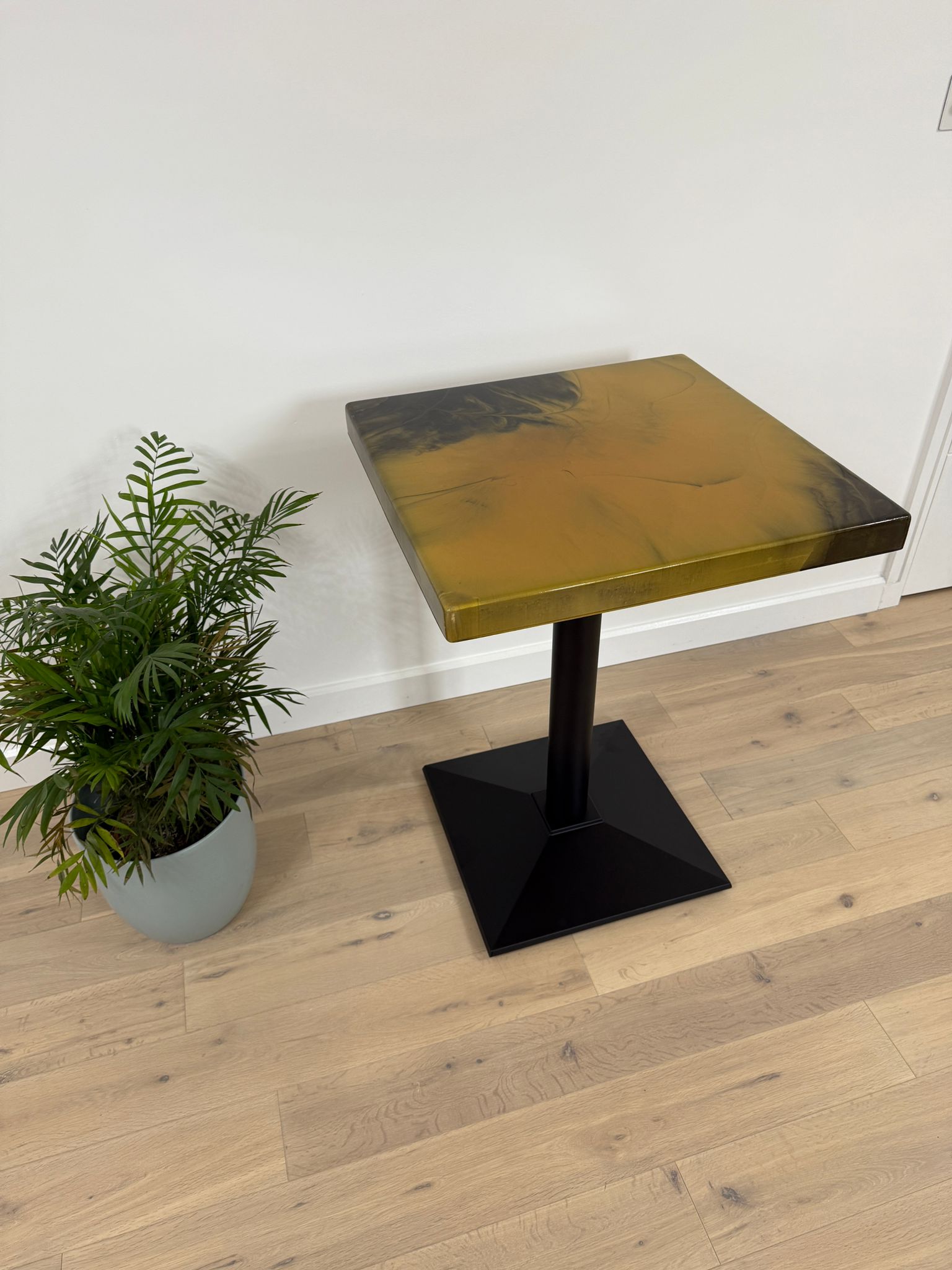 Handmade square epoxy resin dining table with artistic resin top and custom metal base – made to order in the UK.