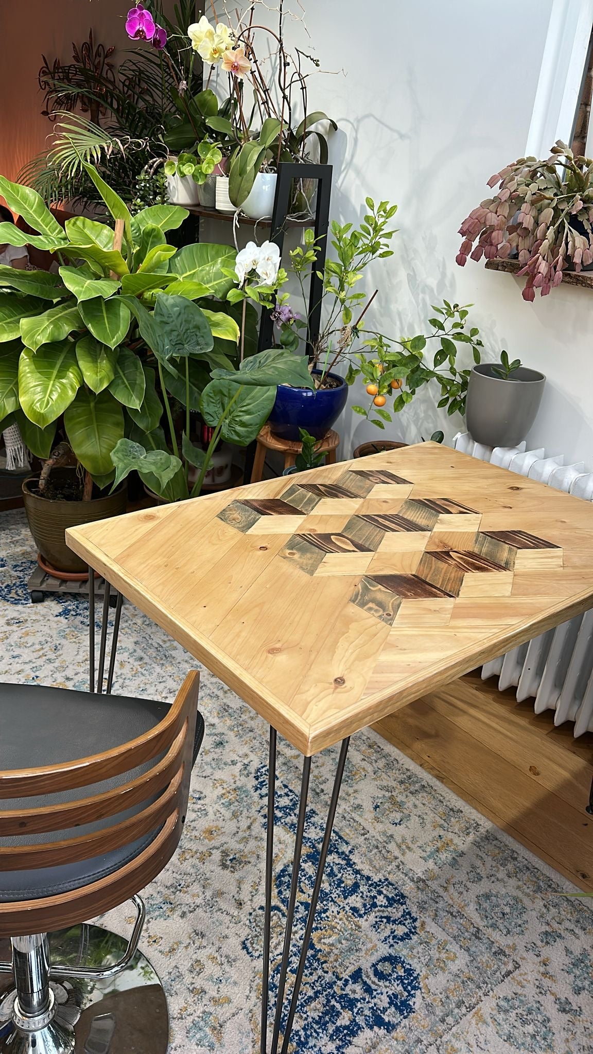 Reclaimed wood dining table with subtle 3D pattern top, handcrafted in the UK, finished with natural wax and showcasing rustic character details