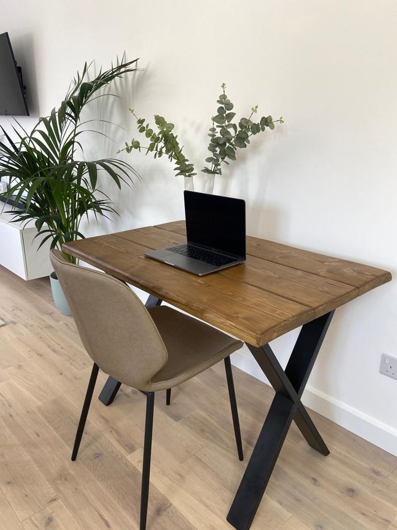 Handmade industrial desk made from reclaimed scaffold boards with steel legs – rustic wood workstation for home office or computer use.