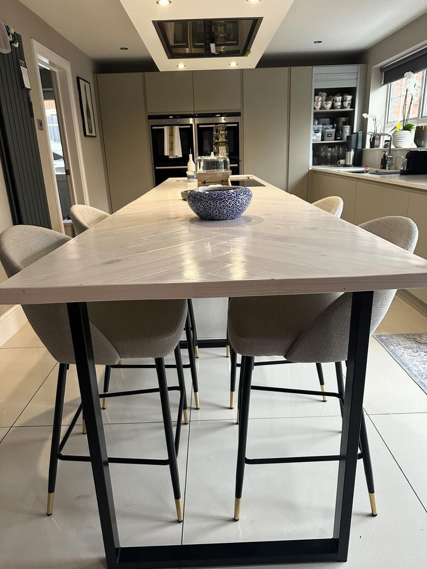 Handmade herringbone breakfast bar crafted from reclaimed wood with custom metal legs, made to order in the UK