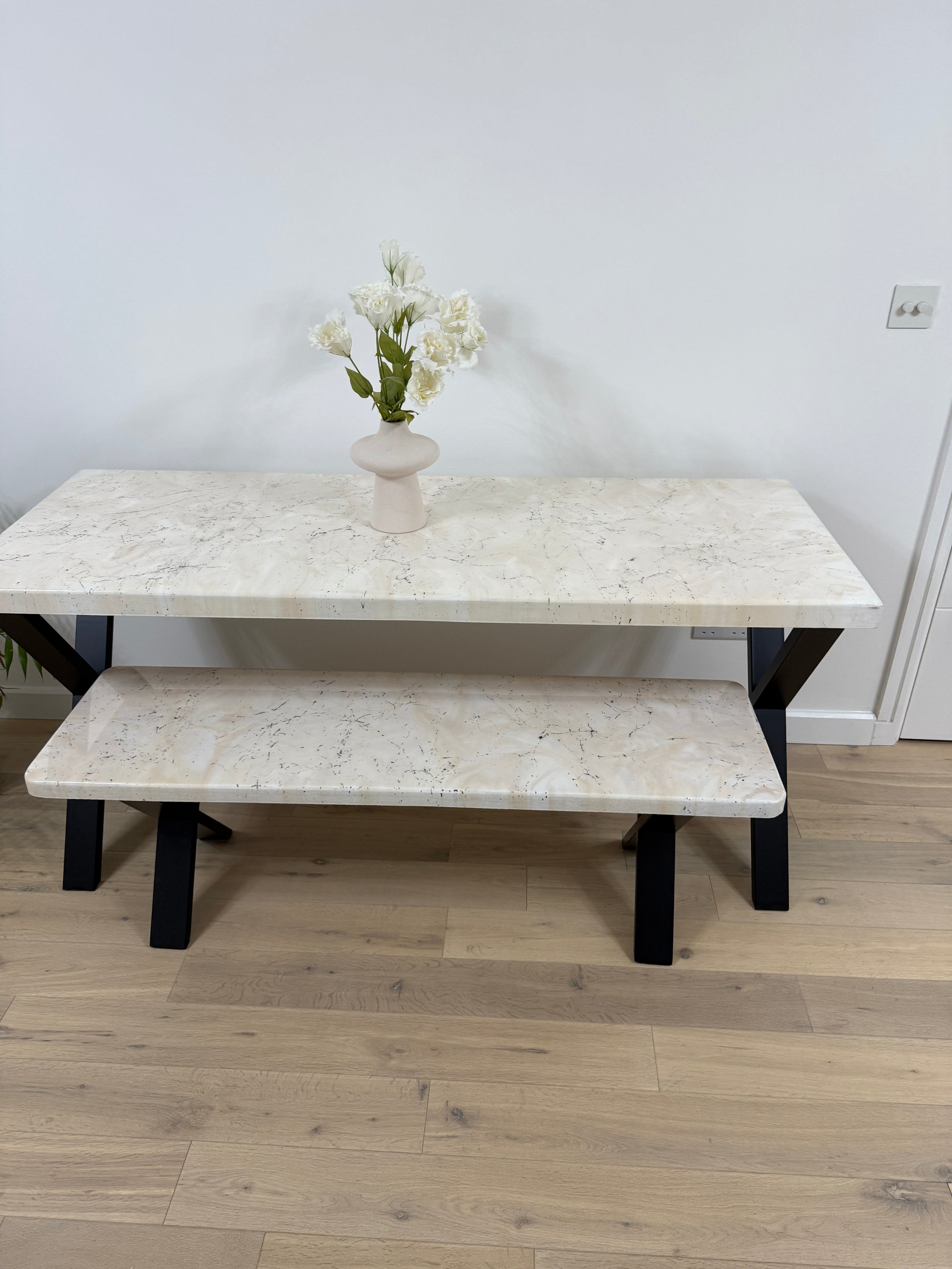 Handmade epoxy resin dining table with artistic marble effect top and custom metal legs – made to order in the UK, optional matching benches available.