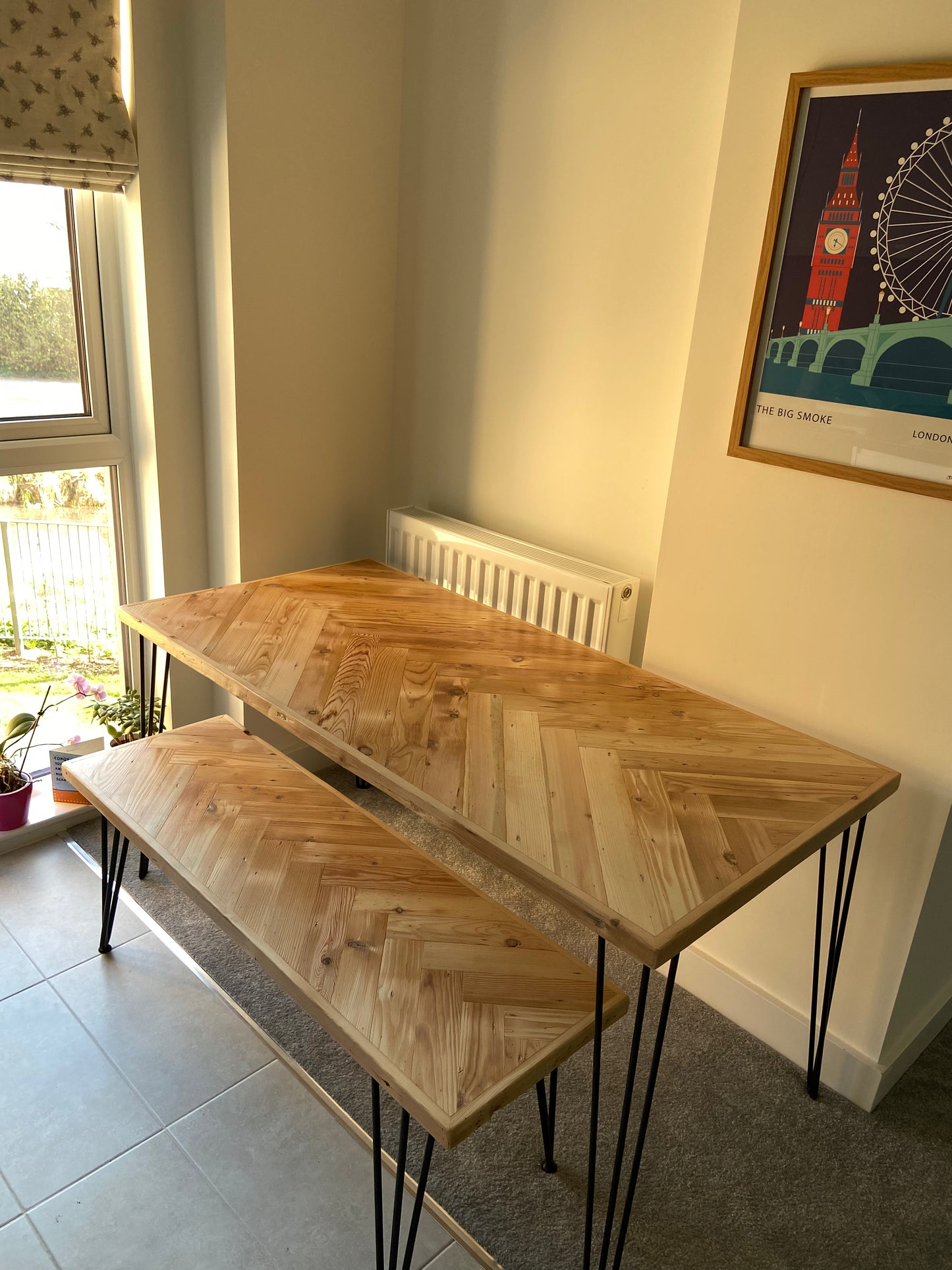 Handmade herringbone table crafted from reclaimed wood with metal legs, made to order in the UK