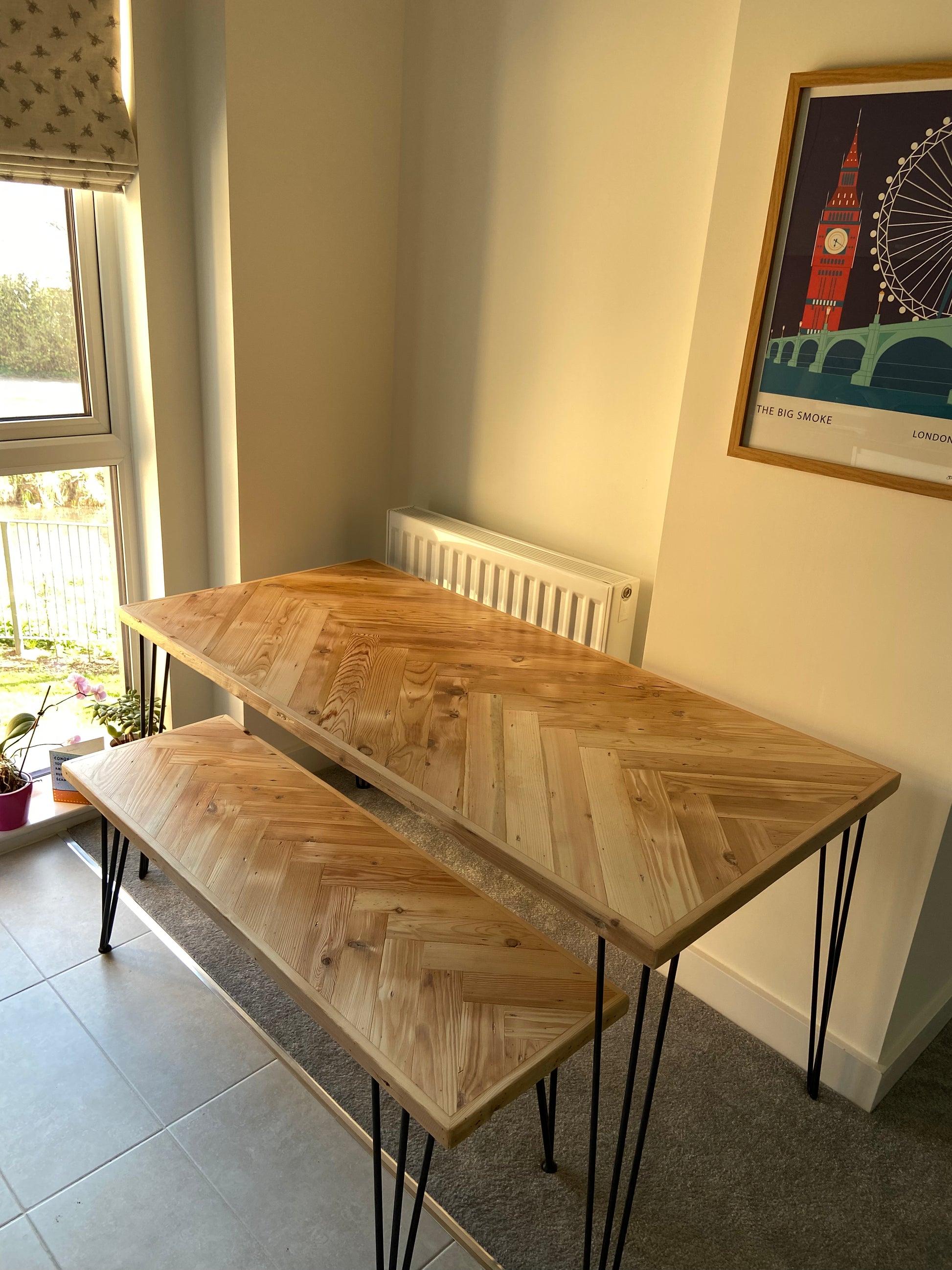 Handmade herringbone table crafted from reclaimed wood with metal legs, made to order in the UK