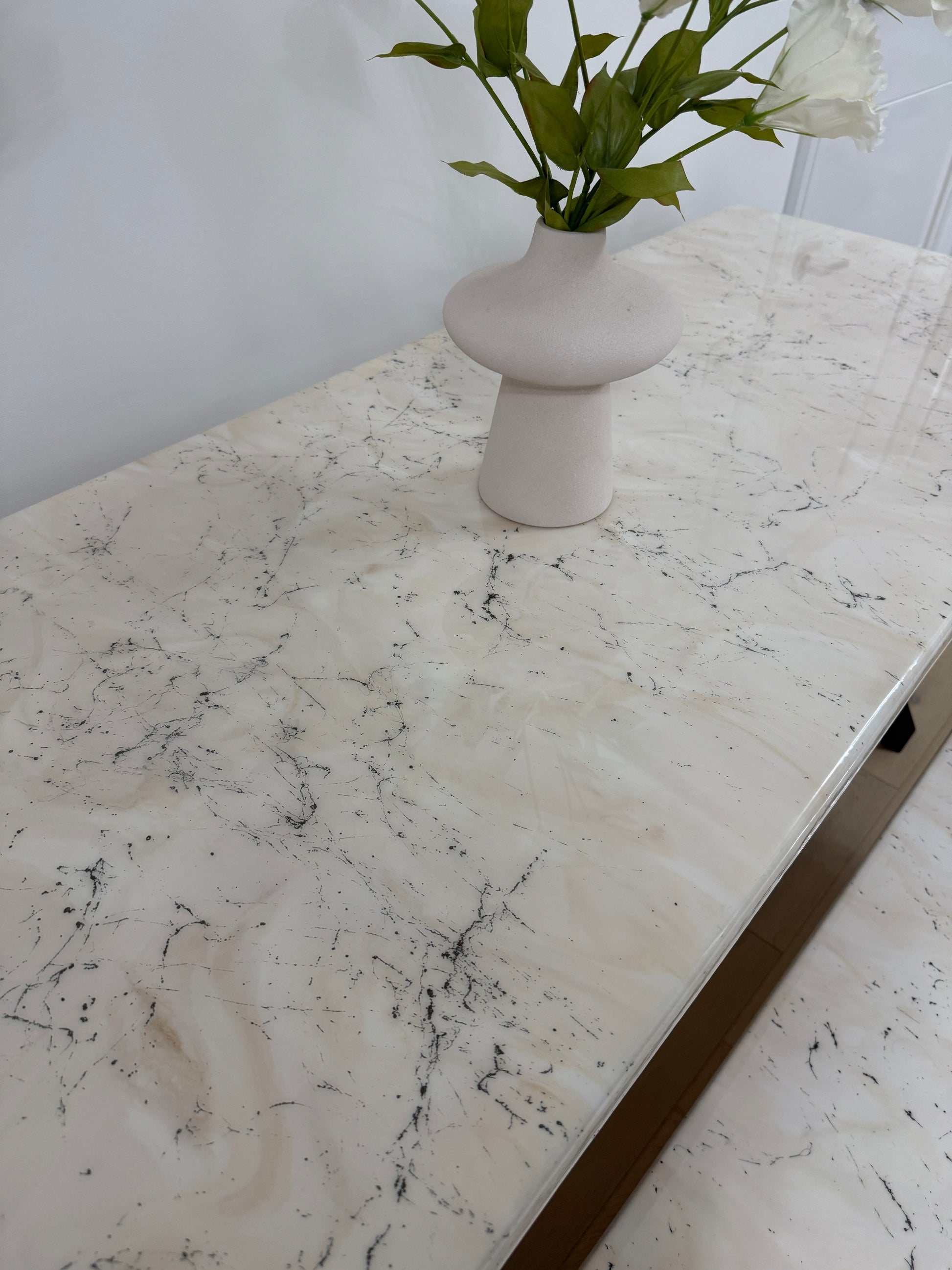 Handmade epoxy resin dining table with artistic marble effect top and custom metal legs – made to order in the UK, optional matching benches available.