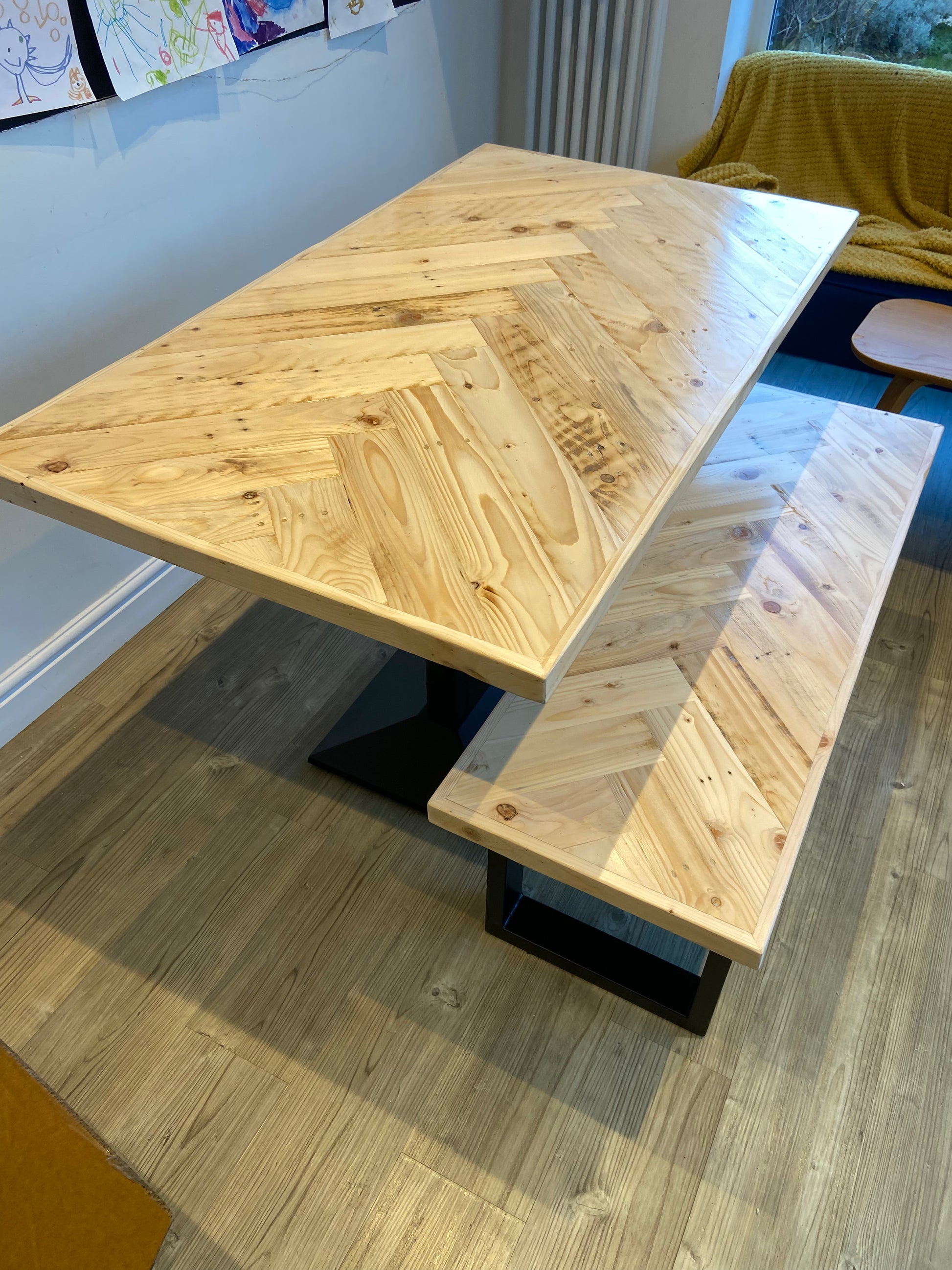 Handmade herringbone dining table with matching reclaimed wood benches