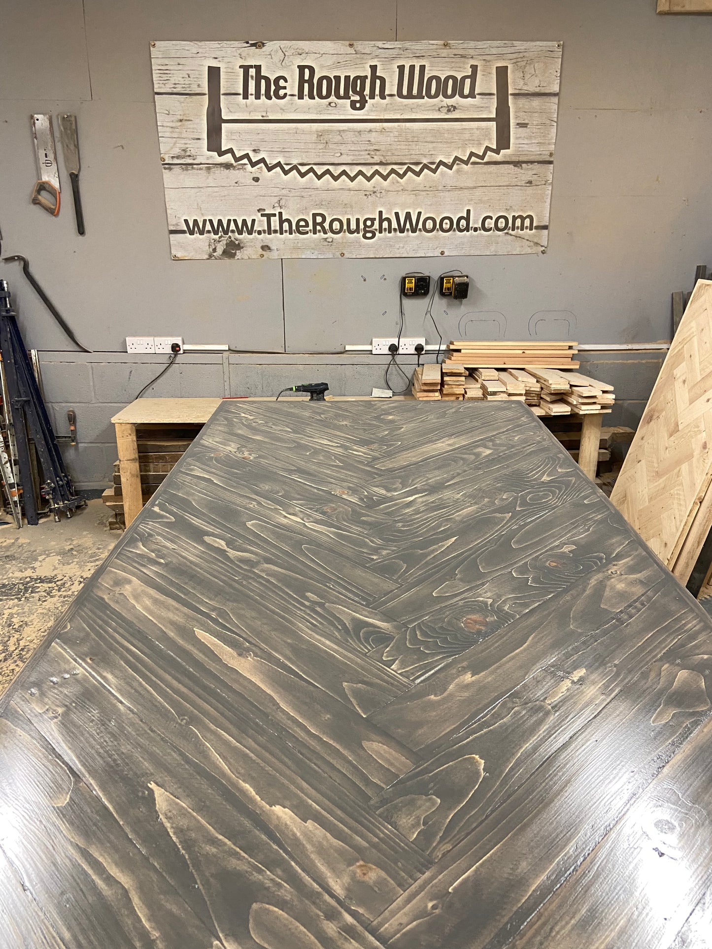 Handmade herringbone breakfast bar crafted from reclaimed wood with custom metal legs, made to order in the UK