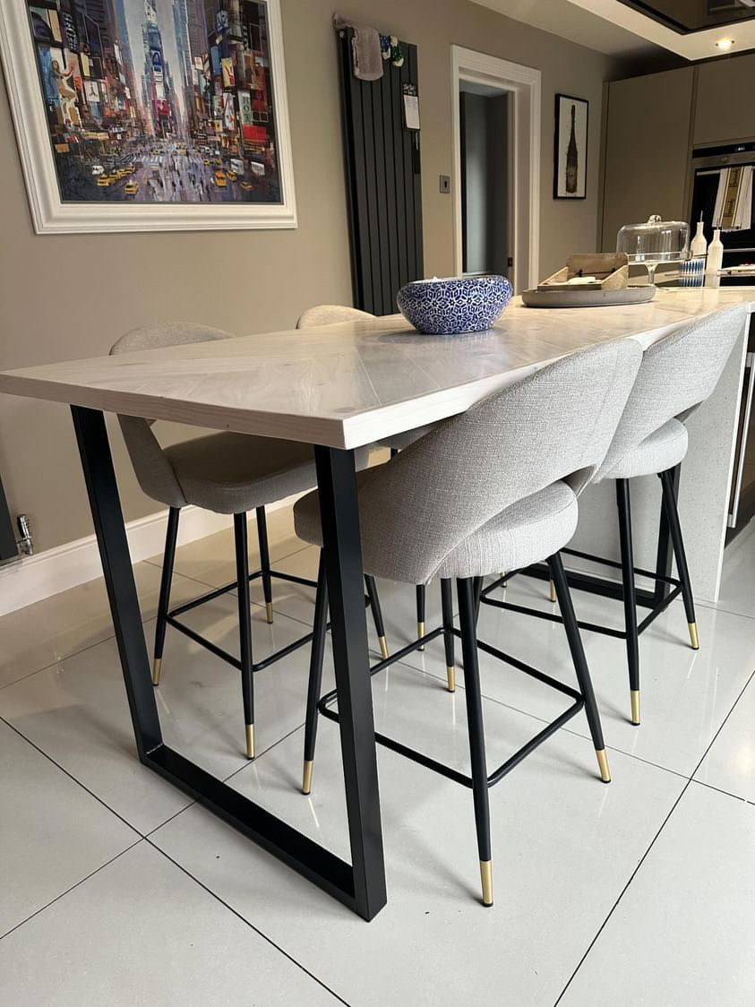 Handmade herringbone breakfast bar crafted from reclaimed wood with custom metal legs, made to order in the UK