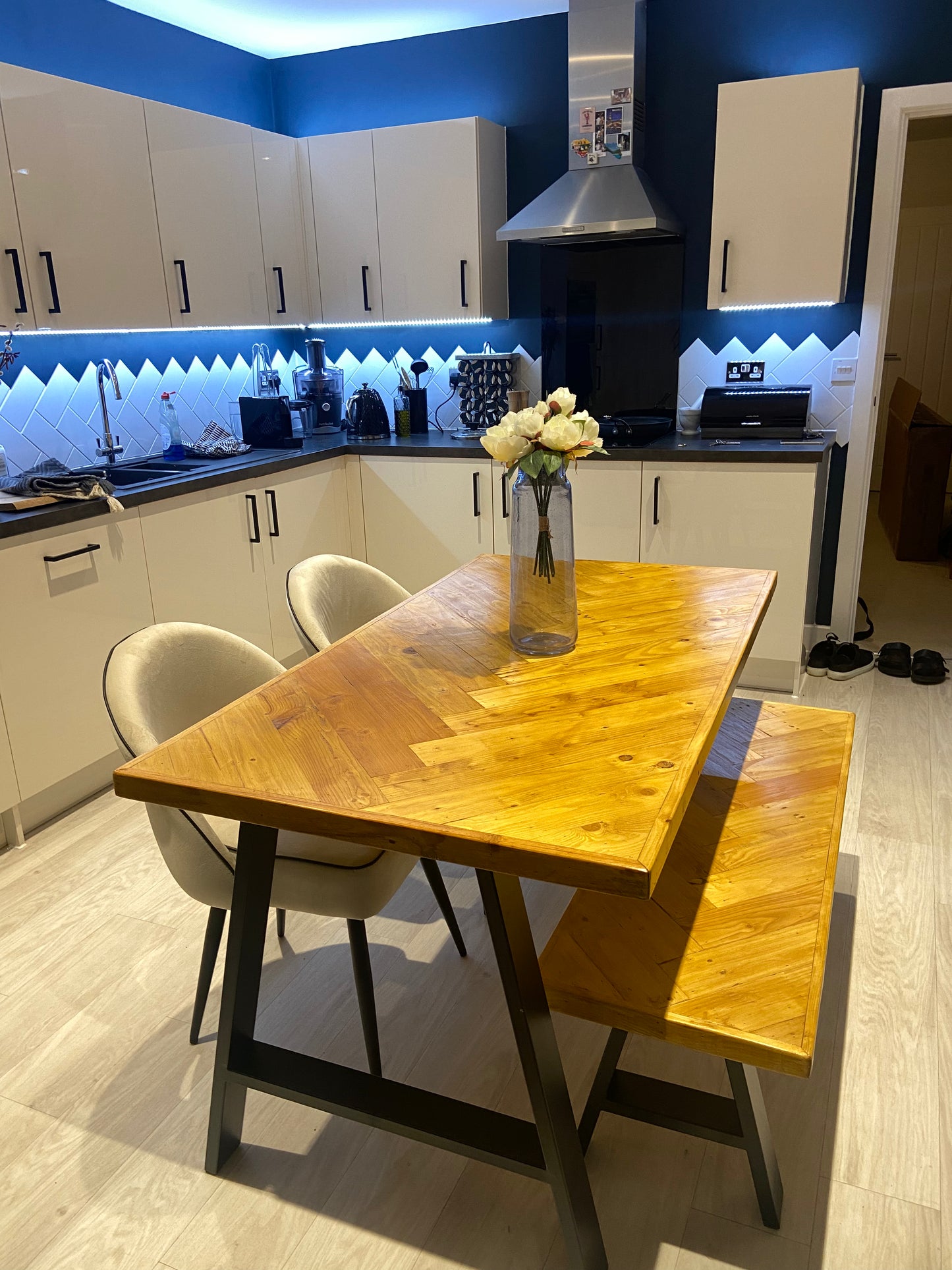 Handcrafted herringbone dining table made from reclaimed wood