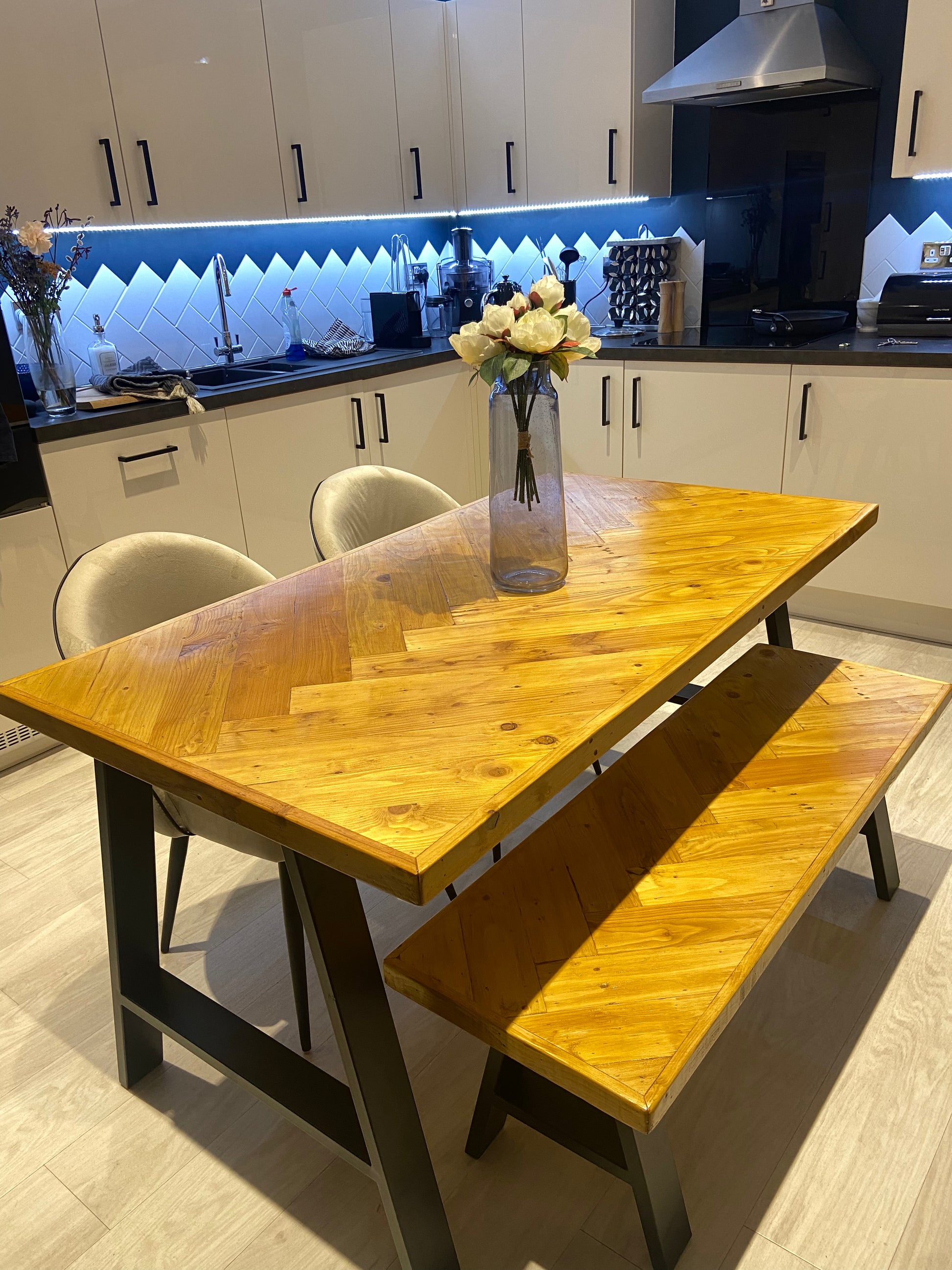 Handcrafted herringbone dining table made from reclaimed wood