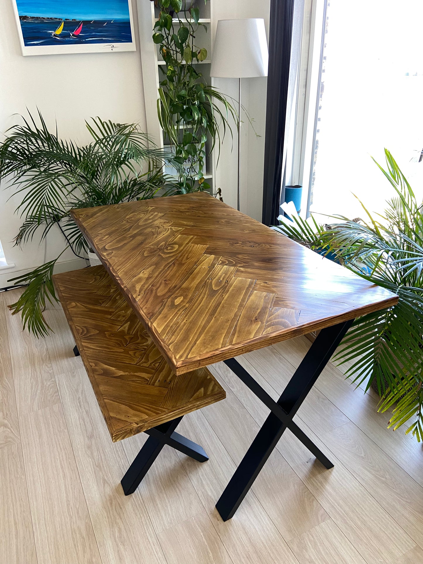 Handcrafted herringbone dining table made from reclaimed wood