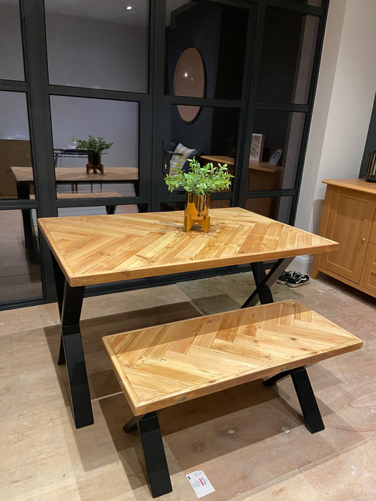 Handmade herringbone table crafted from reclaimed wood with metal legs, made to order in the UK