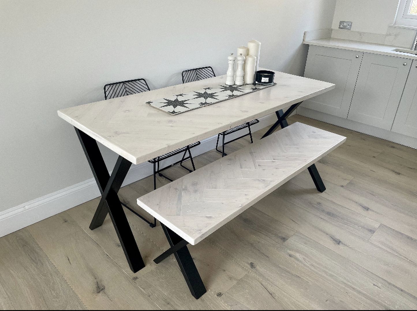 Handcrafted herringbone dining table made from reclaimed wood