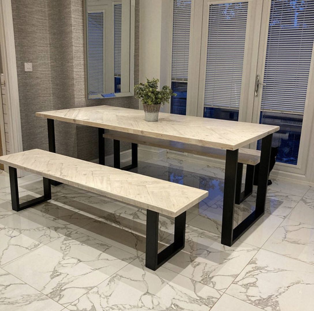 Handcrafted herringbone dining table made from reclaimed wood
