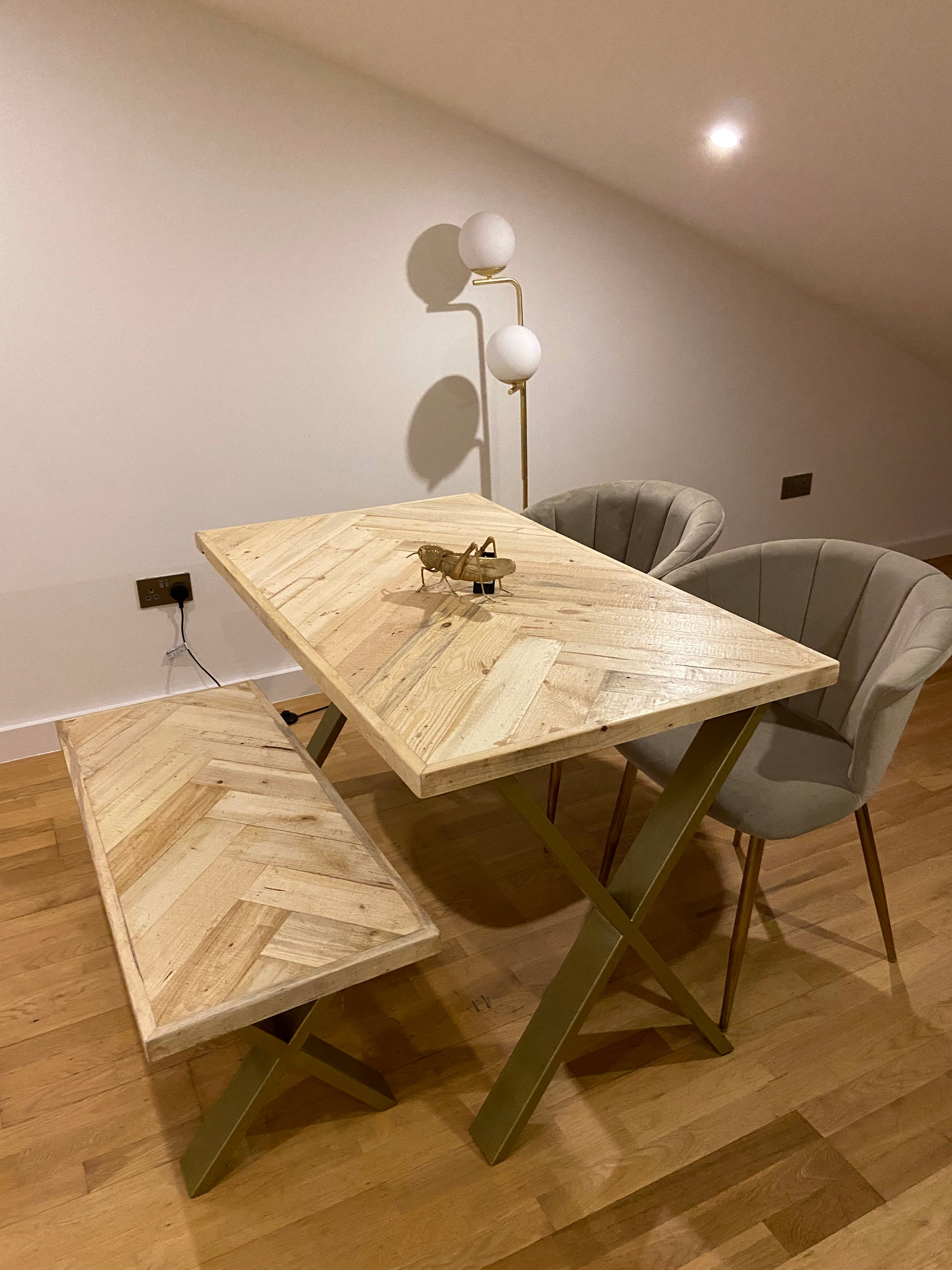Handcrafted herringbone dining table made from reclaimed wood