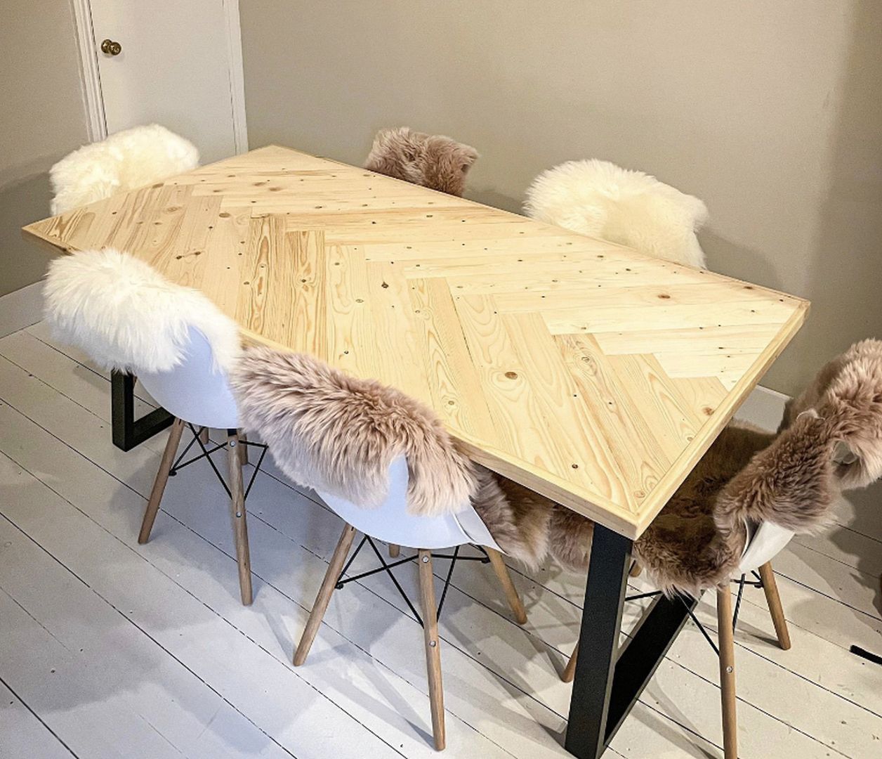 Handcrafted herringbone dining table made from reclaimed wood