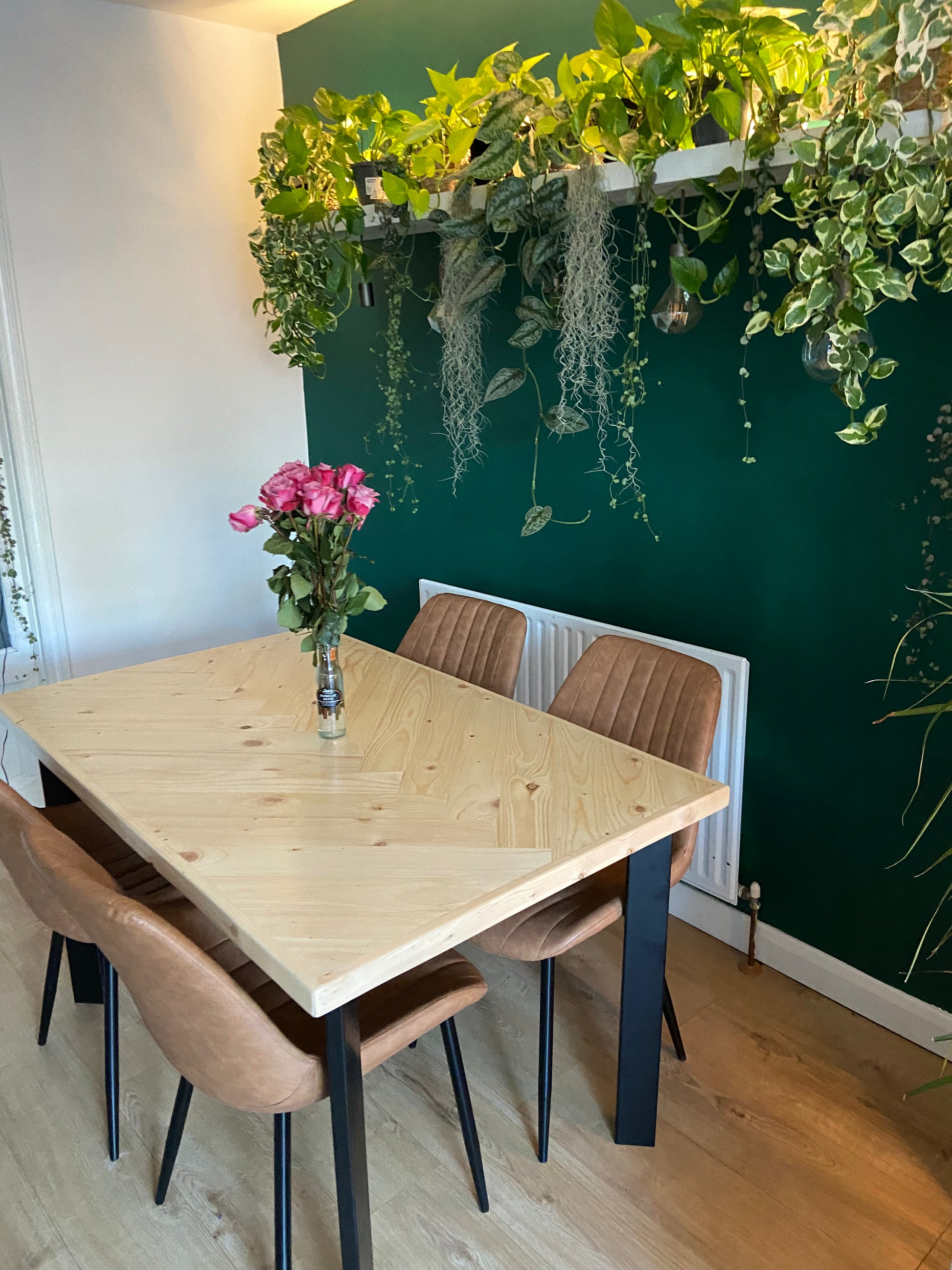 Handcrafted herringbone dining table made from reclaimed wood