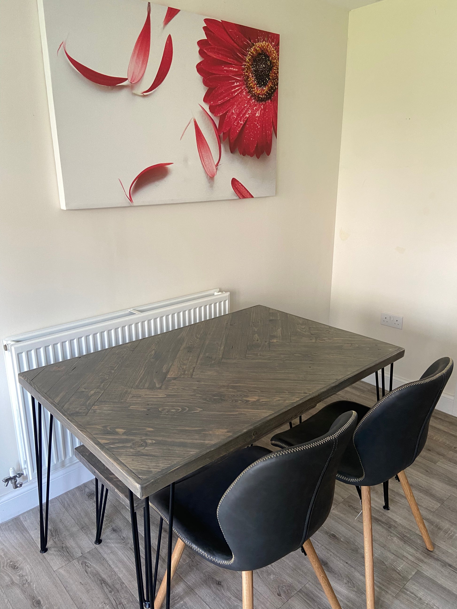 Handcrafted herringbone dining table made from reclaimed wood