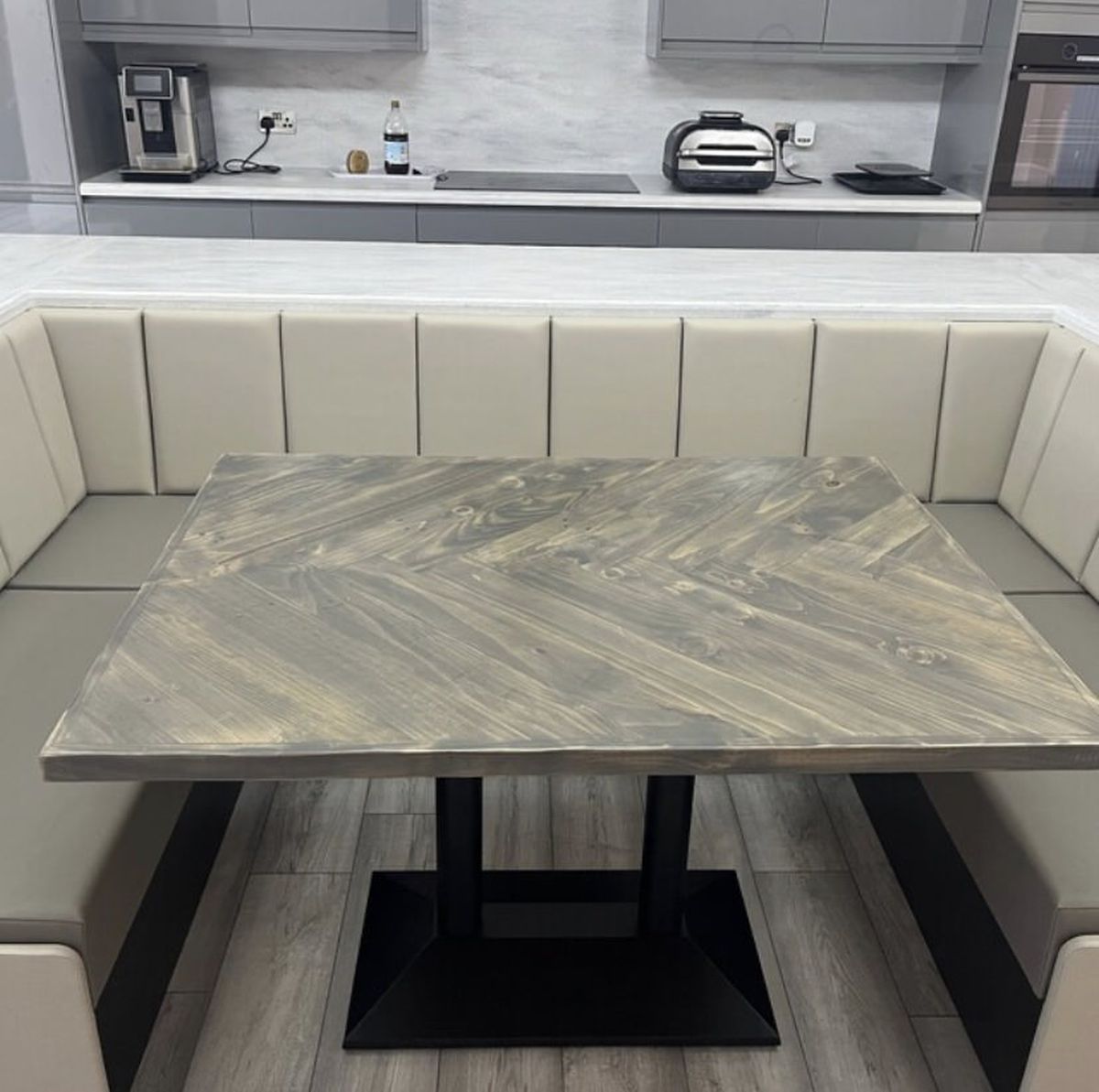 Handmade herringbone dining table with matching reclaimed wood benches