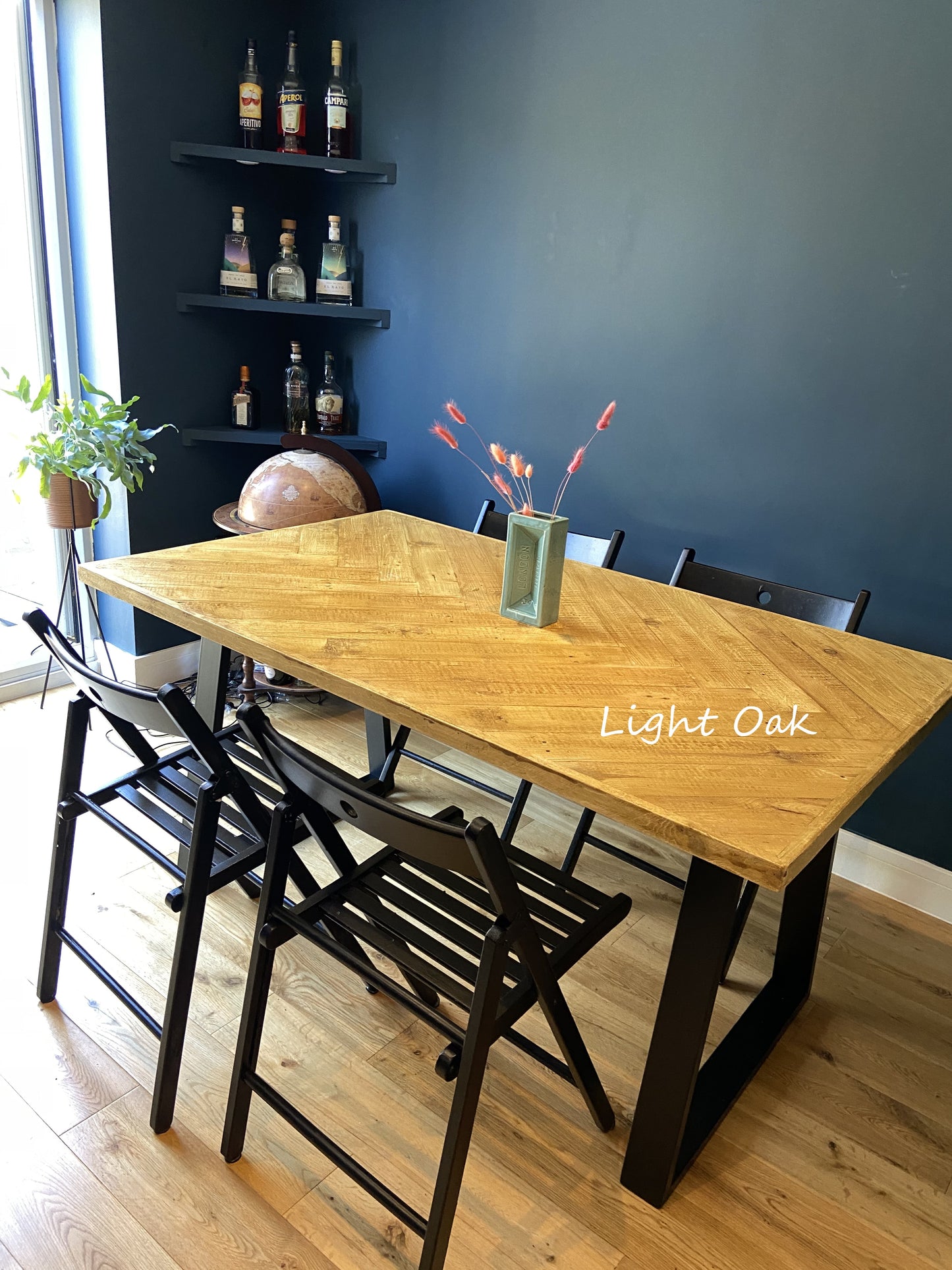 Handcrafted herringbone dining table made from reclaimed wood