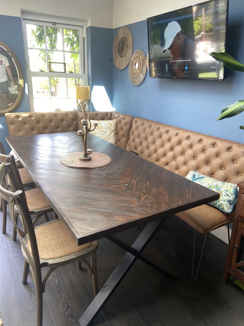 Handcrafted herringbone dining table made from reclaimed wood