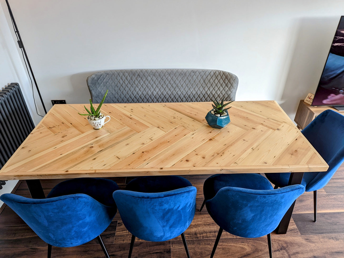 Handmade herringbone table crafted from reclaimed wood with metal legs, made to order in the UK
