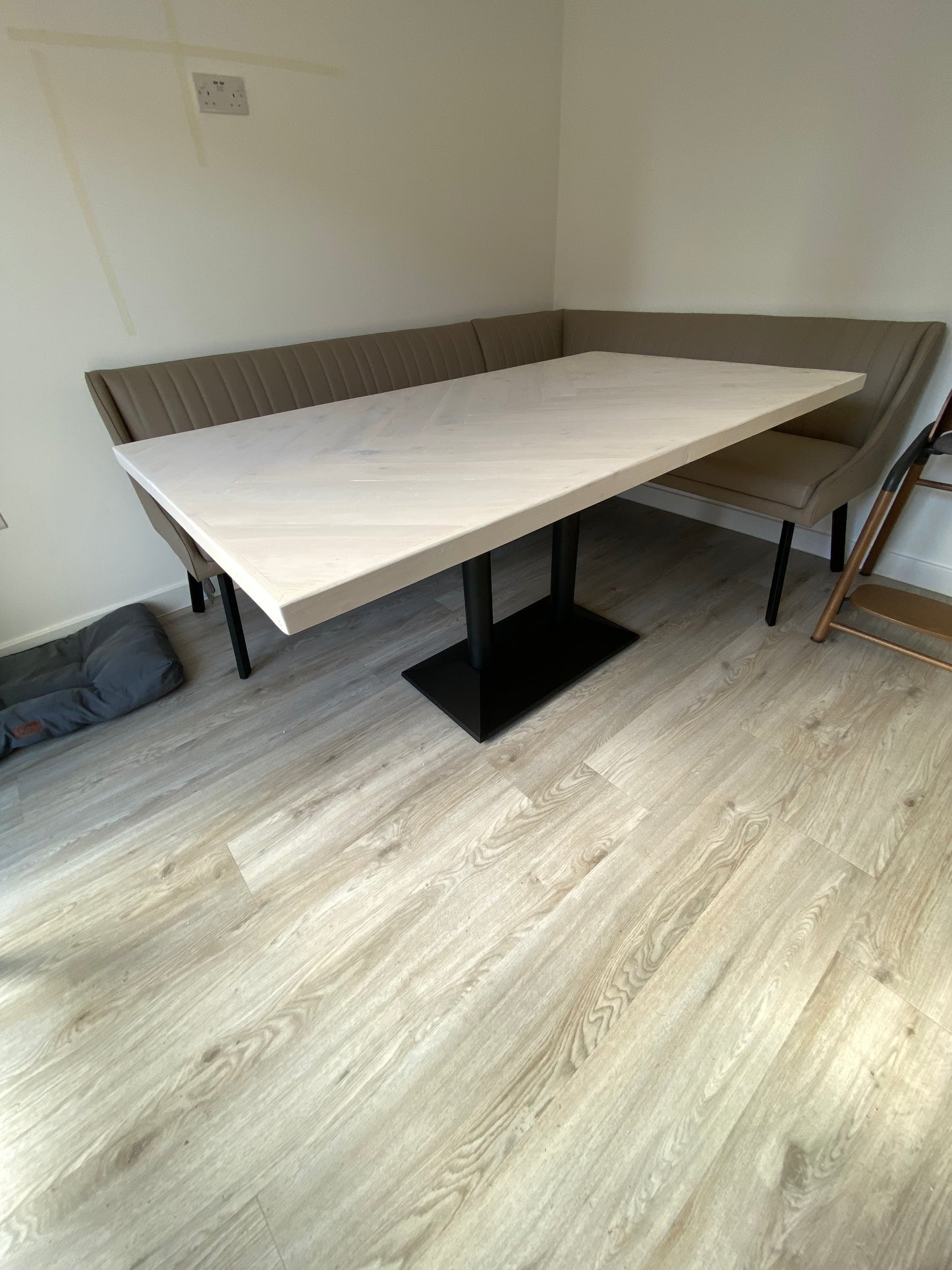 Handmade herringbone dining table with matching reclaimed wood benches