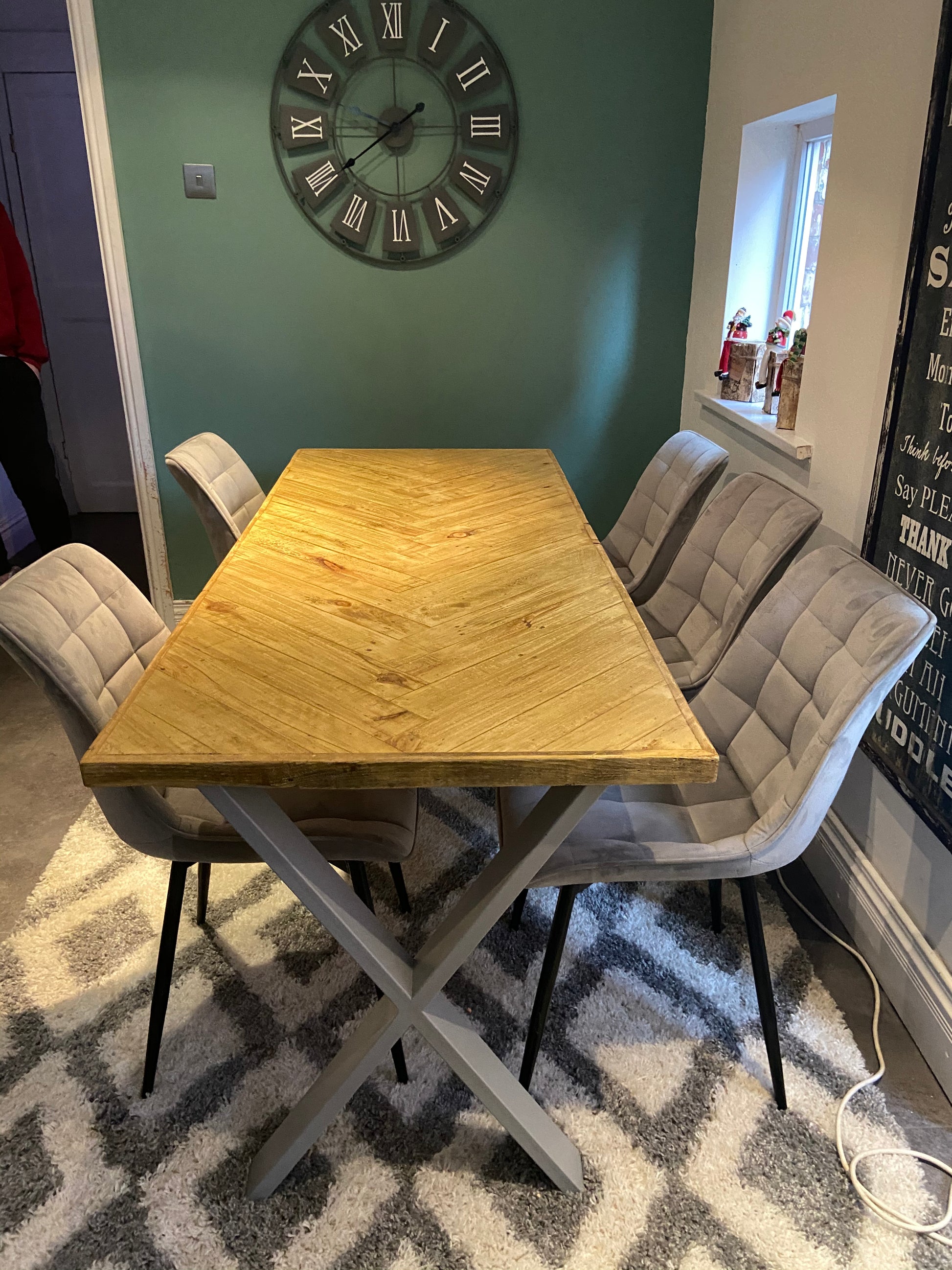 Handcrafted herringbone dining table made from reclaimed wood