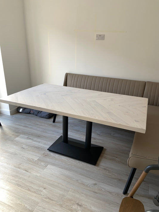 Handmade herringbone dining table with matching reclaimed wood benches