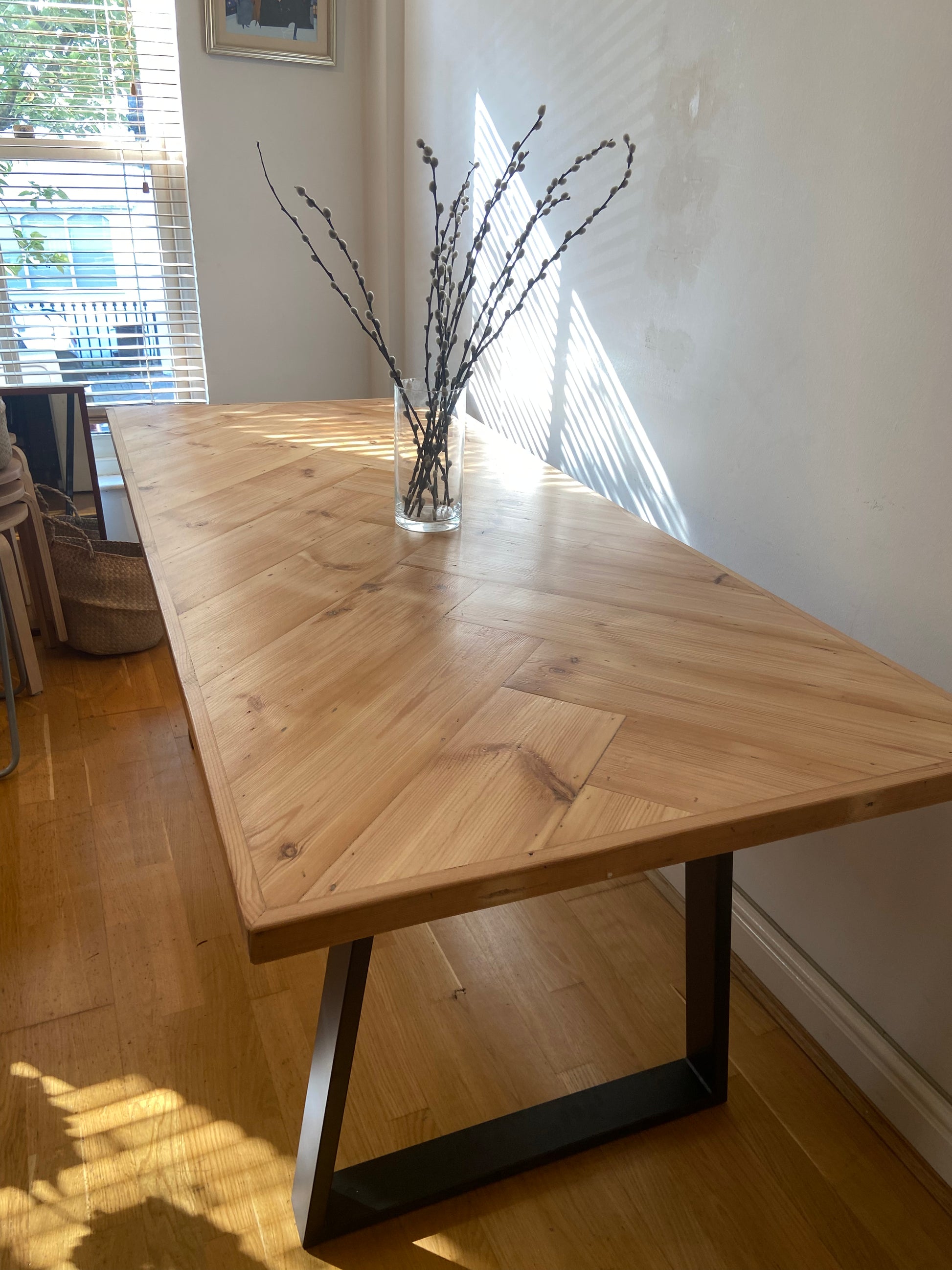Handmade herringbone table crafted from reclaimed wood with metal legs, made to order in the UK