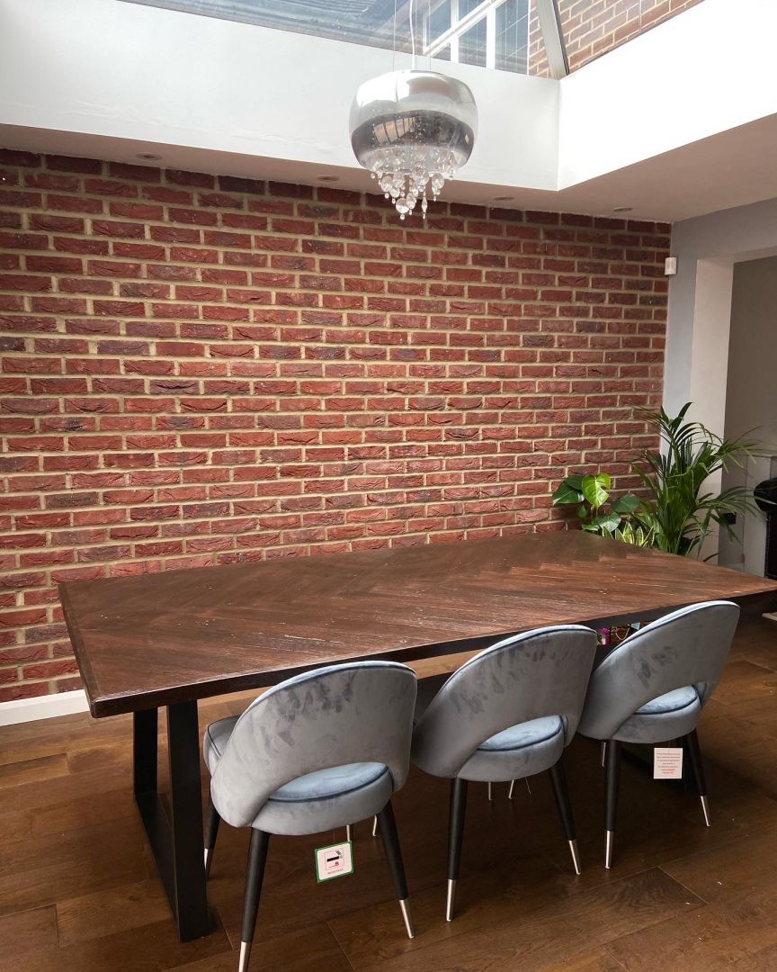 Handcrafted herringbone dining table made from reclaimed wood