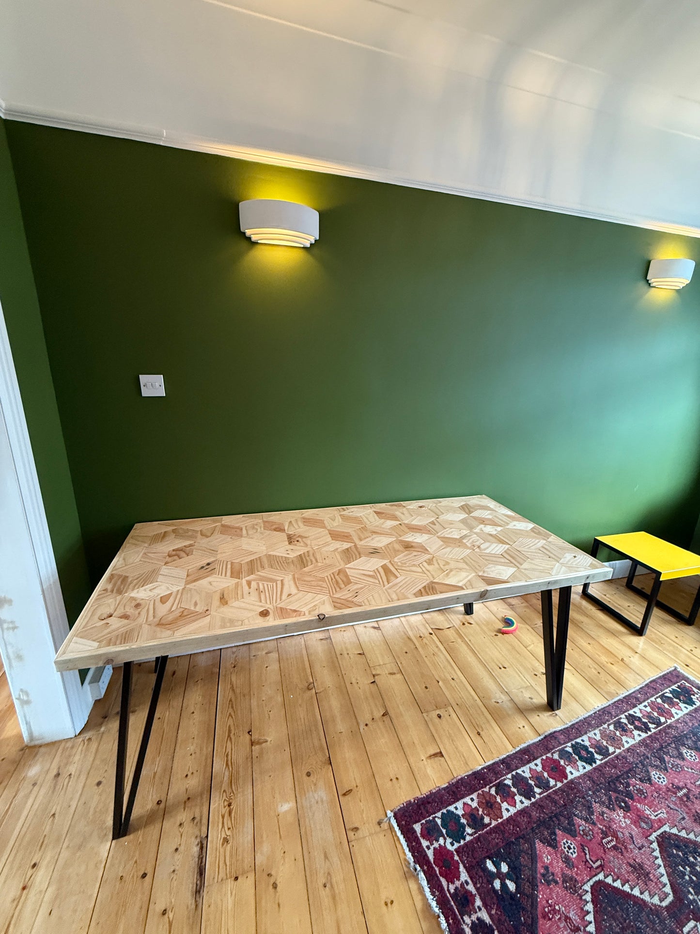 Handcrafted 3D reclaimed wood dining table with unique random pattern top, natural wax finish, and rustic character details like saw marks and paint traces