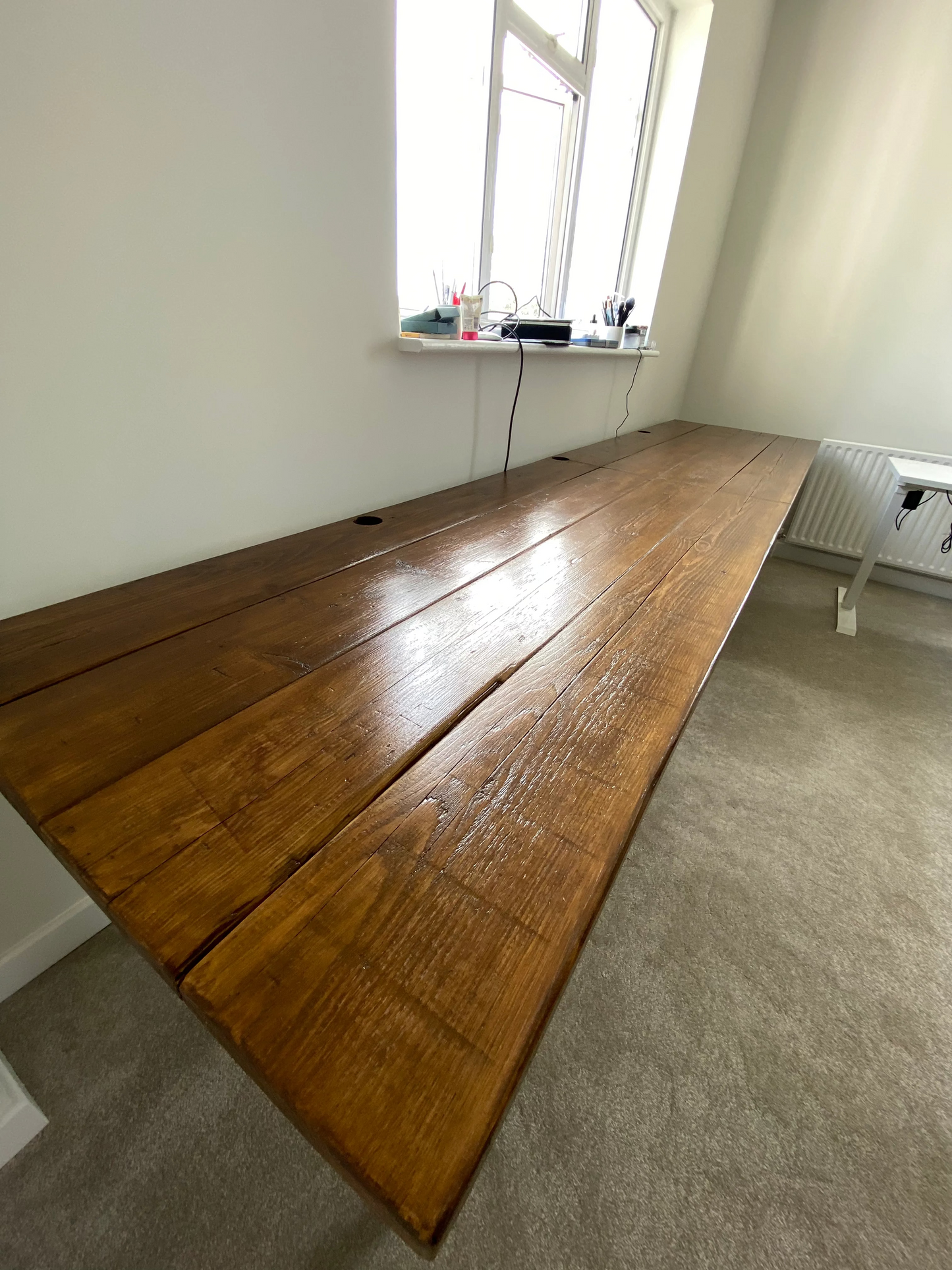 Handmade industrial desk made from reclaimed scaffold boards with steel legs – rustic wood workstation for home office or computer use.
