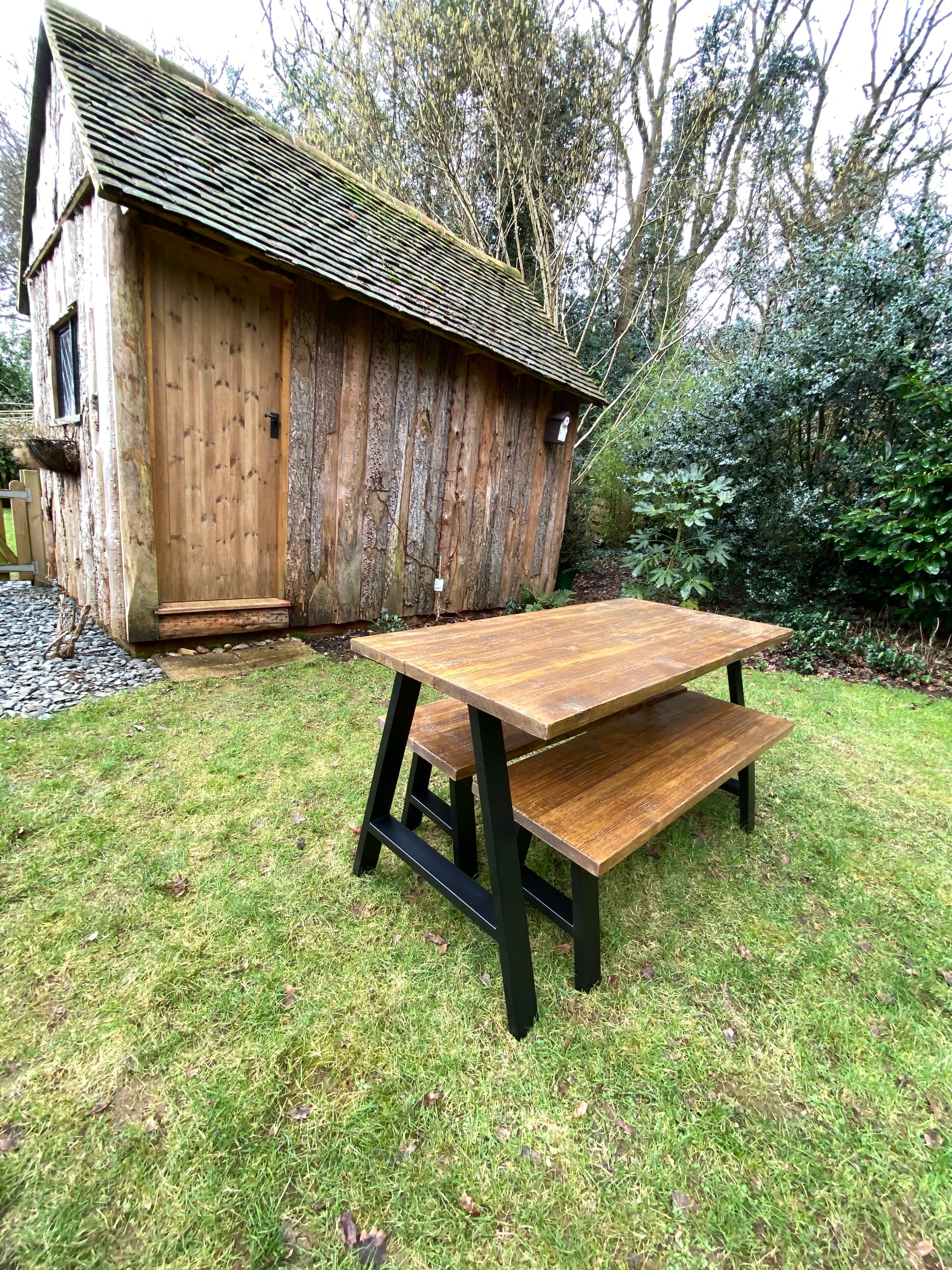Handcrafted outdoor dining table made from reclaimed scaffold boards