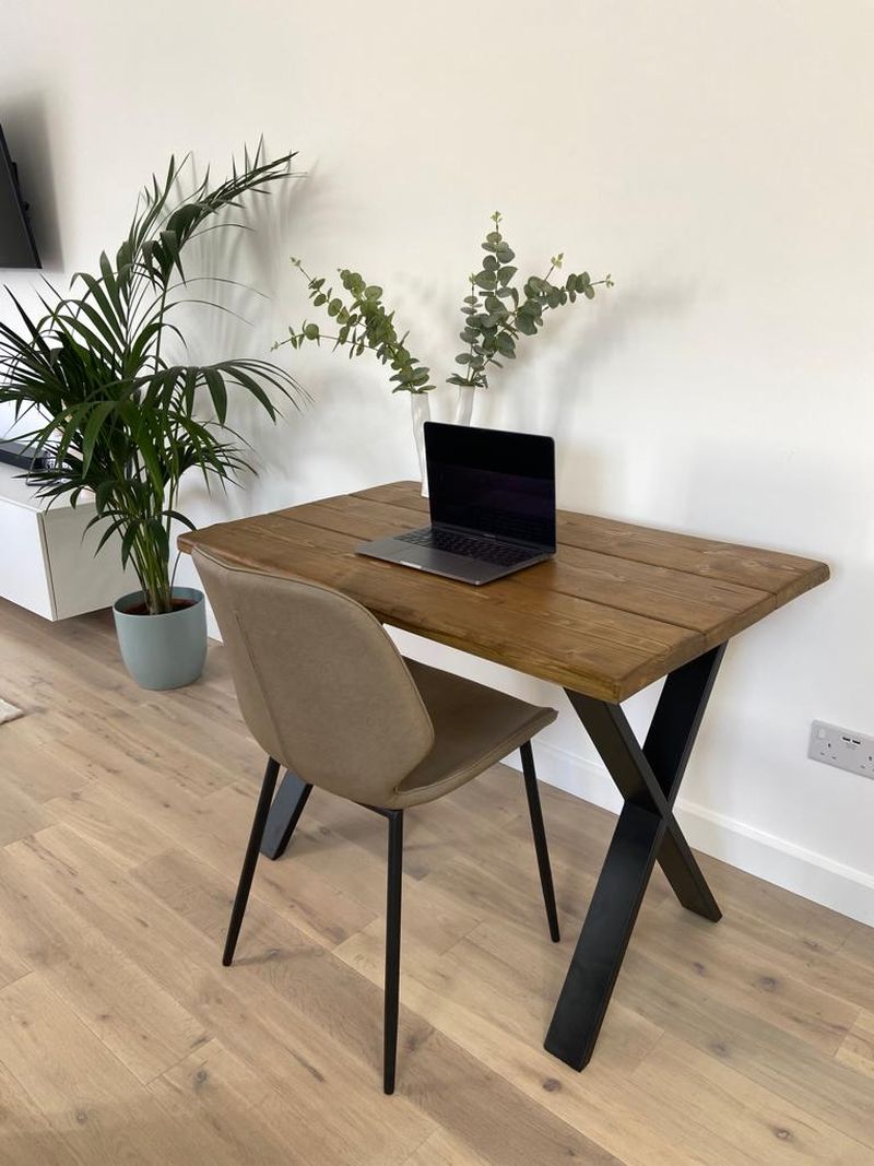 Handmade industrial desk made from reclaimed scaffold boards with steel legs – rustic wood workstation for home office or computer use.