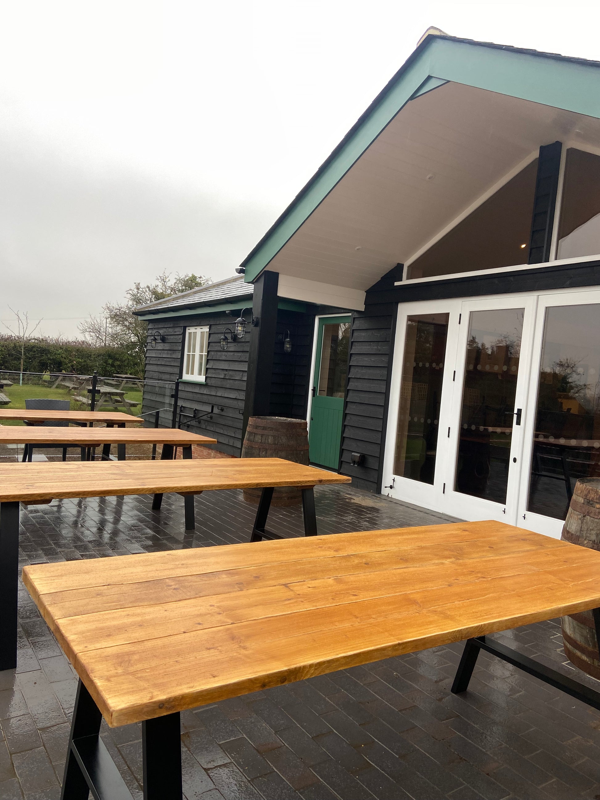 Handcrafted outdoor dining table made from reclaimed scaffold boards