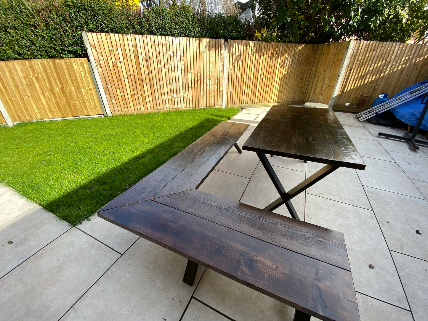 Handcrafted outdoor dining table made from reclaimed scaffold boards