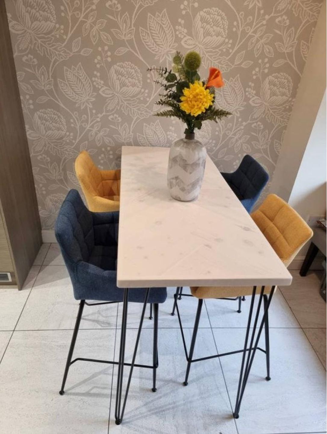 Handmade herringbone breakfast bar crafted from reclaimed wood with custom metal legs, made to order in the UK