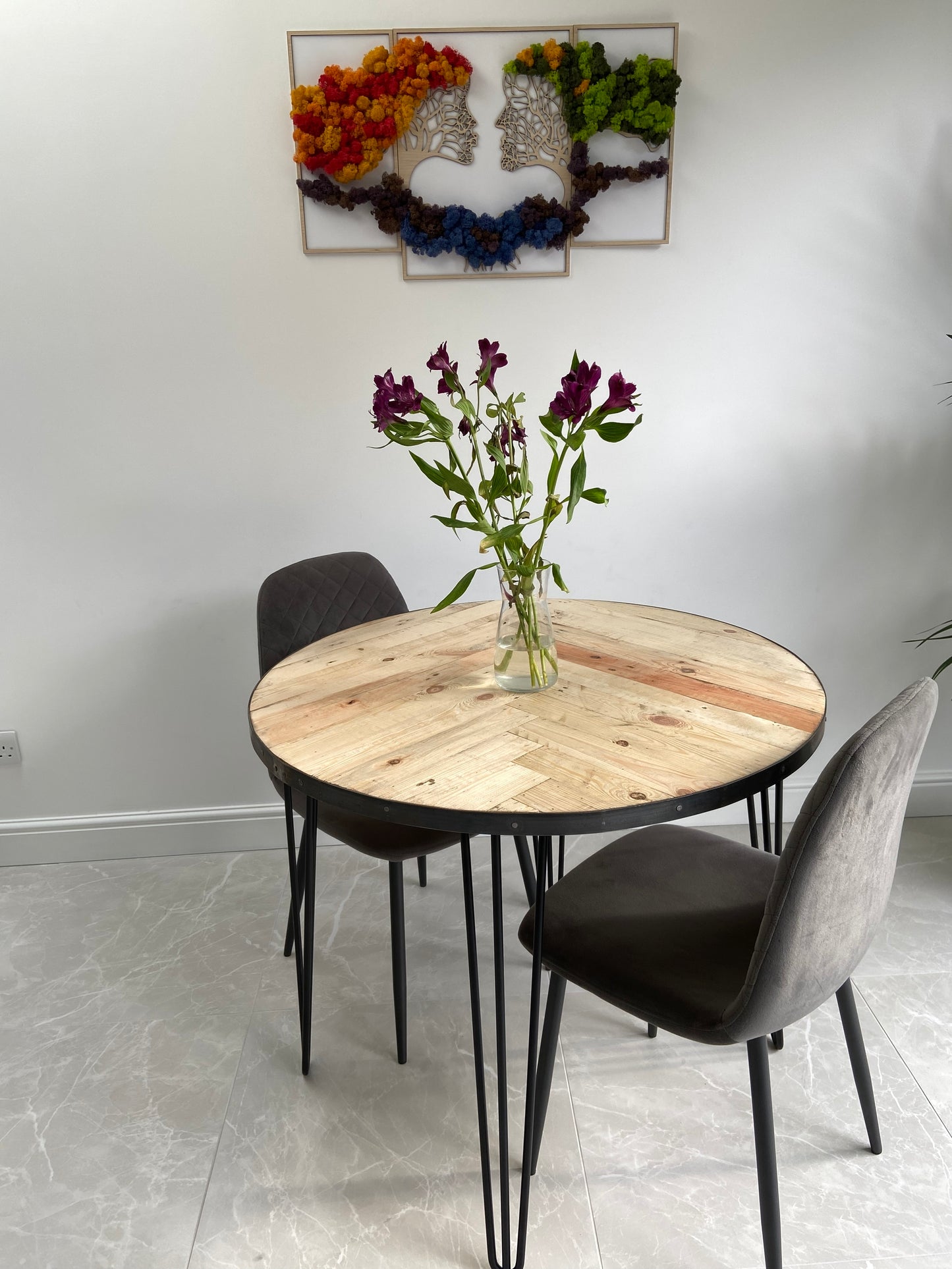 Handmade round reclaimed wood dining table with double herringbone pattern, smooth sanded top, and natural wax finish – rustic and elegant UK craftsmanship