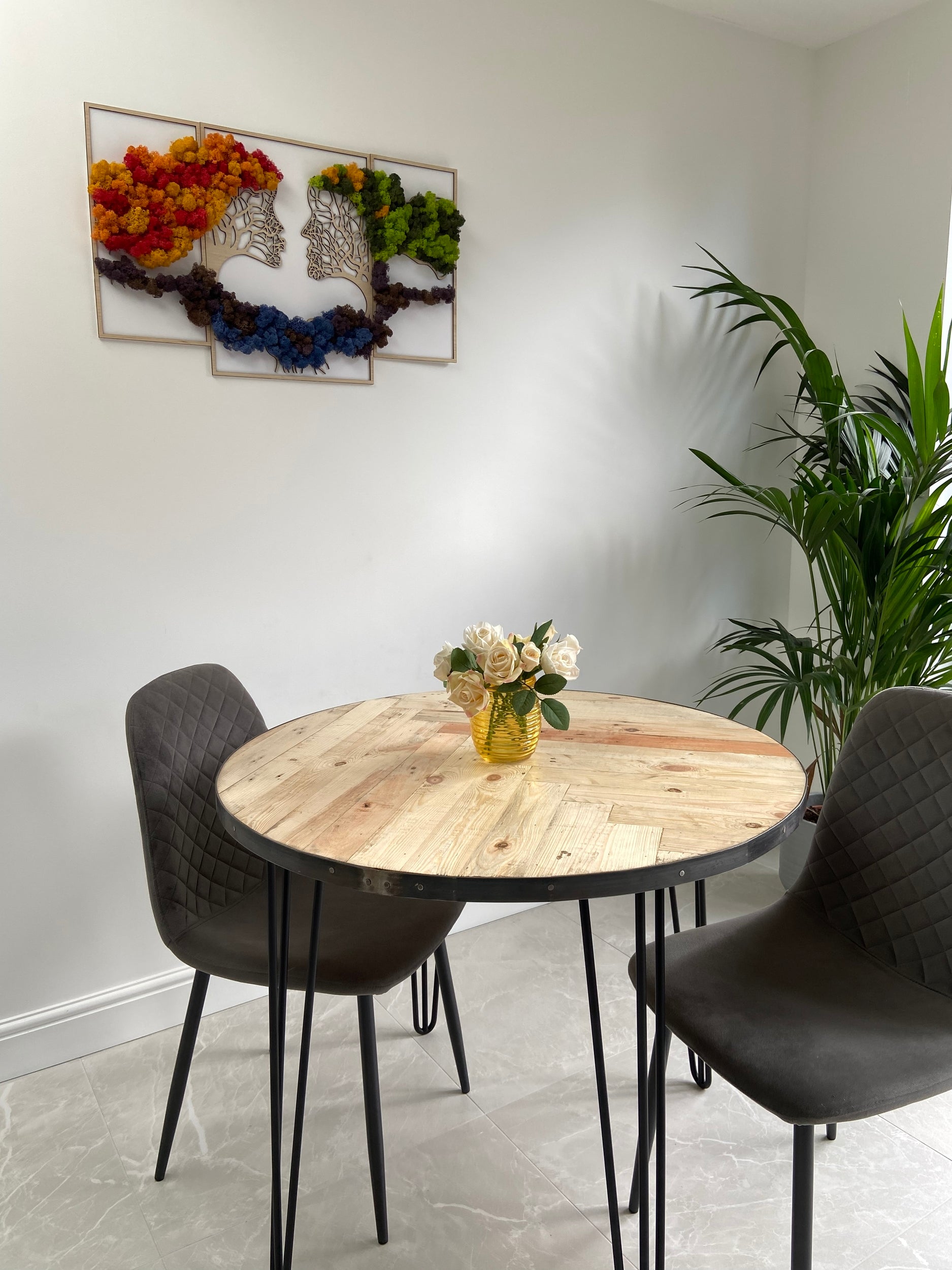 Handmade round reclaimed wood dining table with double herringbone pattern, smooth sanded top, and natural wax finish – rustic and elegant UK craftsmanship