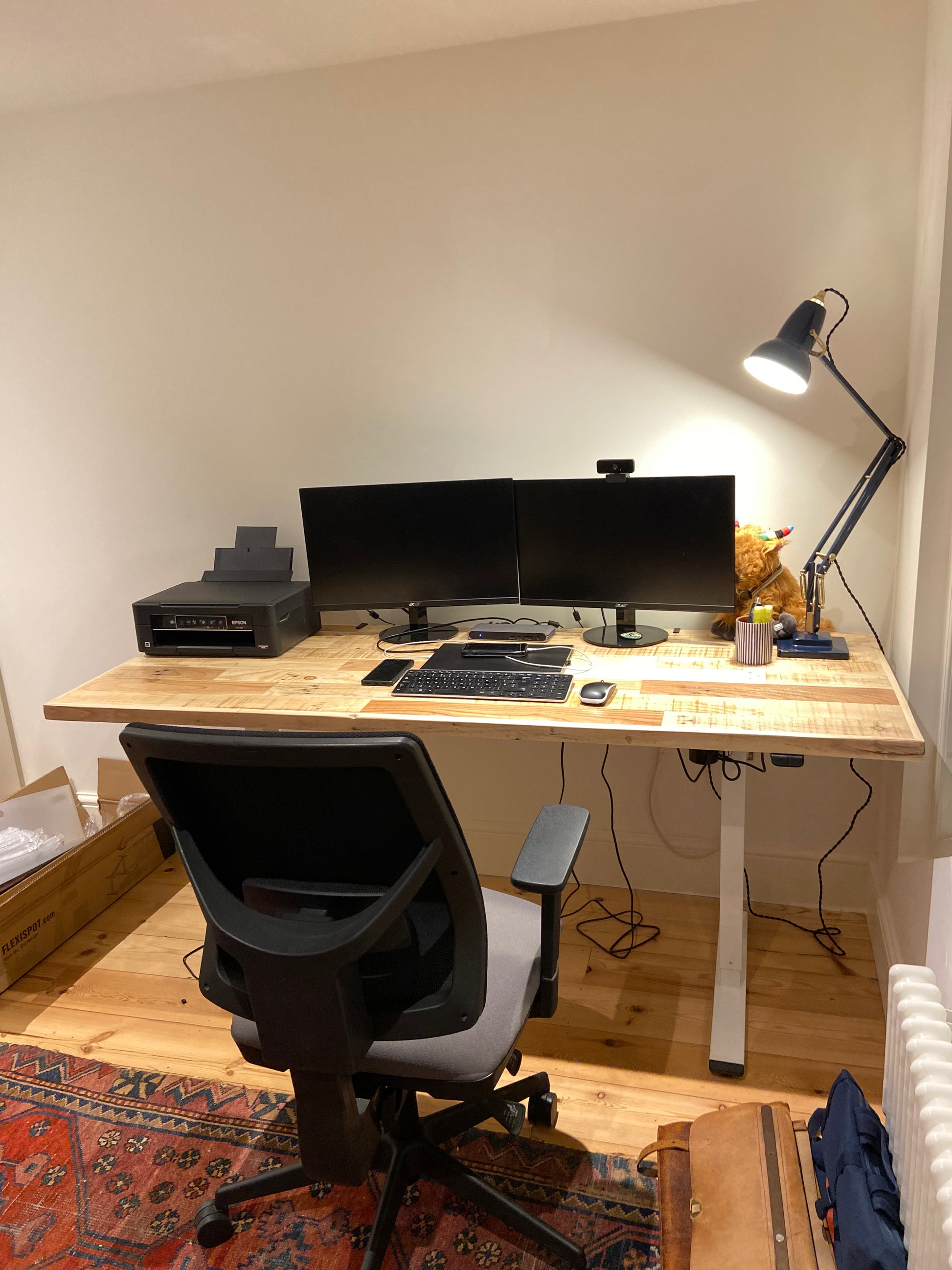 Adjustable height desk with reclaimed wood top and electric legs, featuring LED smart handset with memory presets and child lock – handcrafted sit-stand desk for home or office.