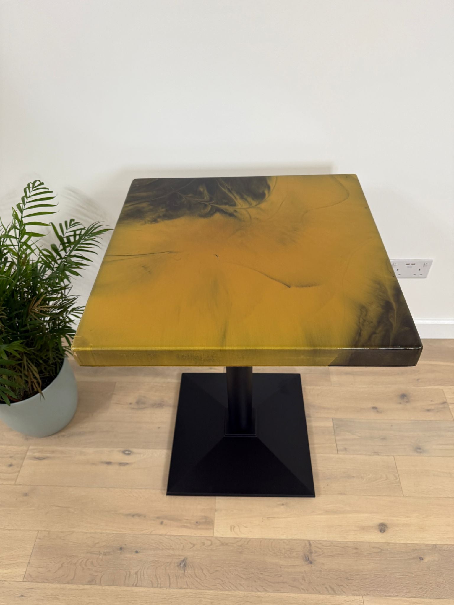 Handmade square epoxy resin dining table with artistic resin top and custom metal base – made to order in the UK.