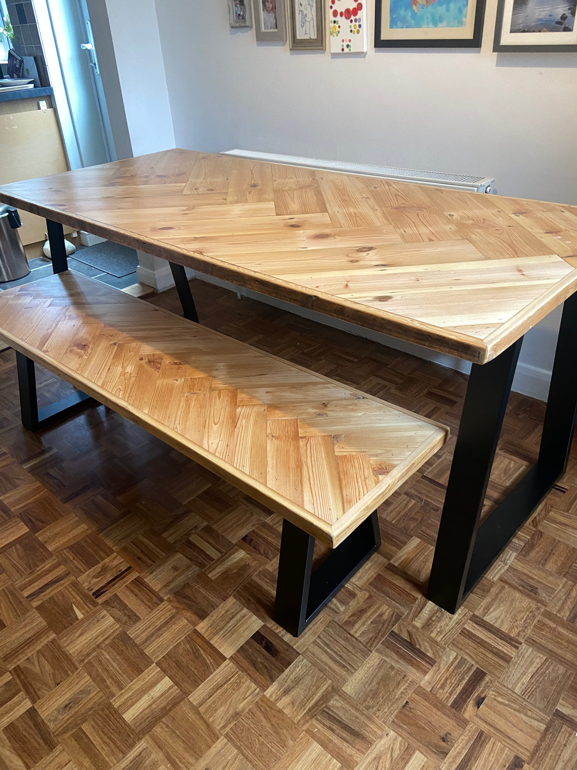 Handmade herringbone table crafted from reclaimed wood with metal legs, made to order in the UK