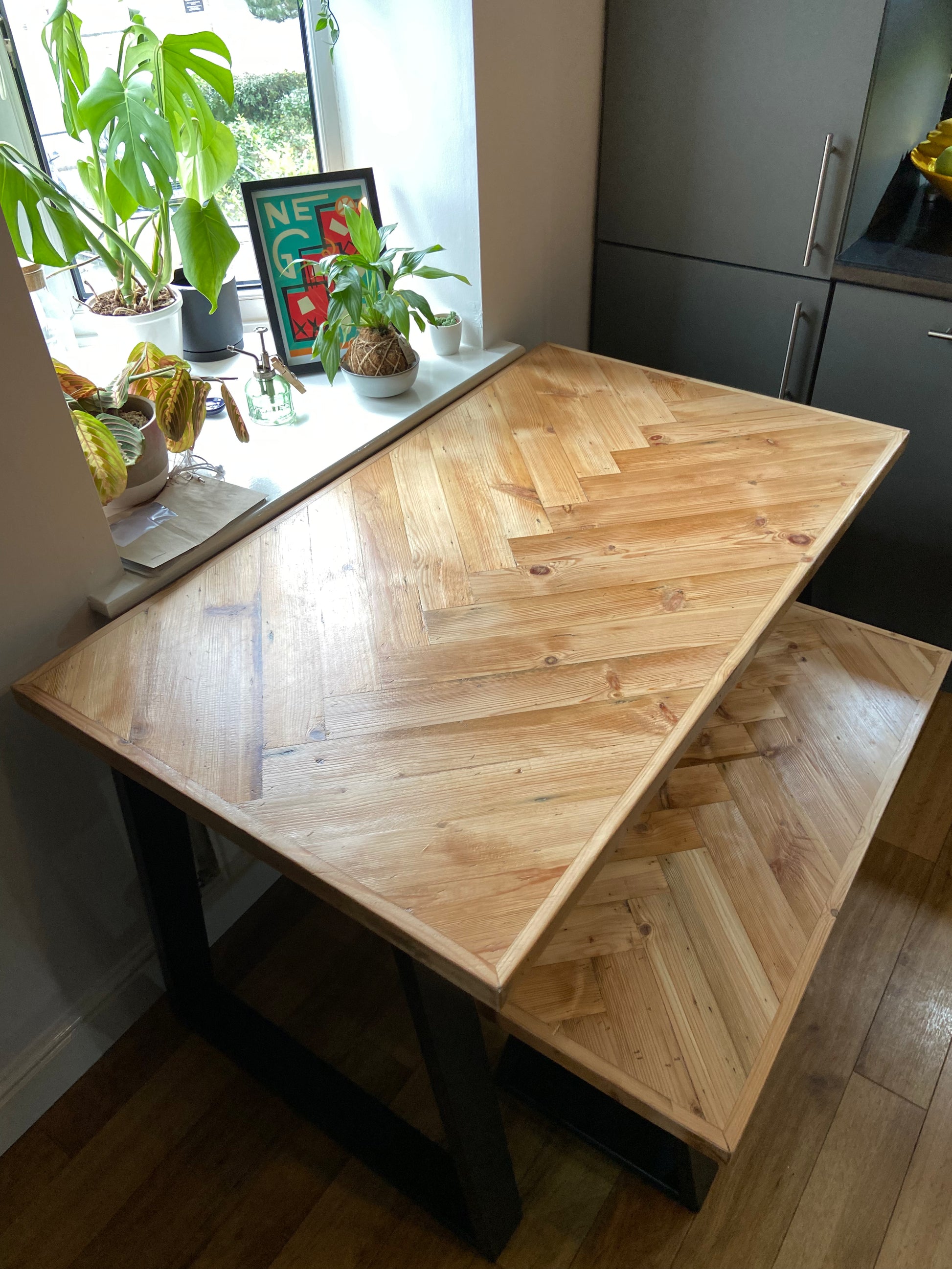 Handmade herringbone table crafted from reclaimed wood with metal legs, made to order in the UK