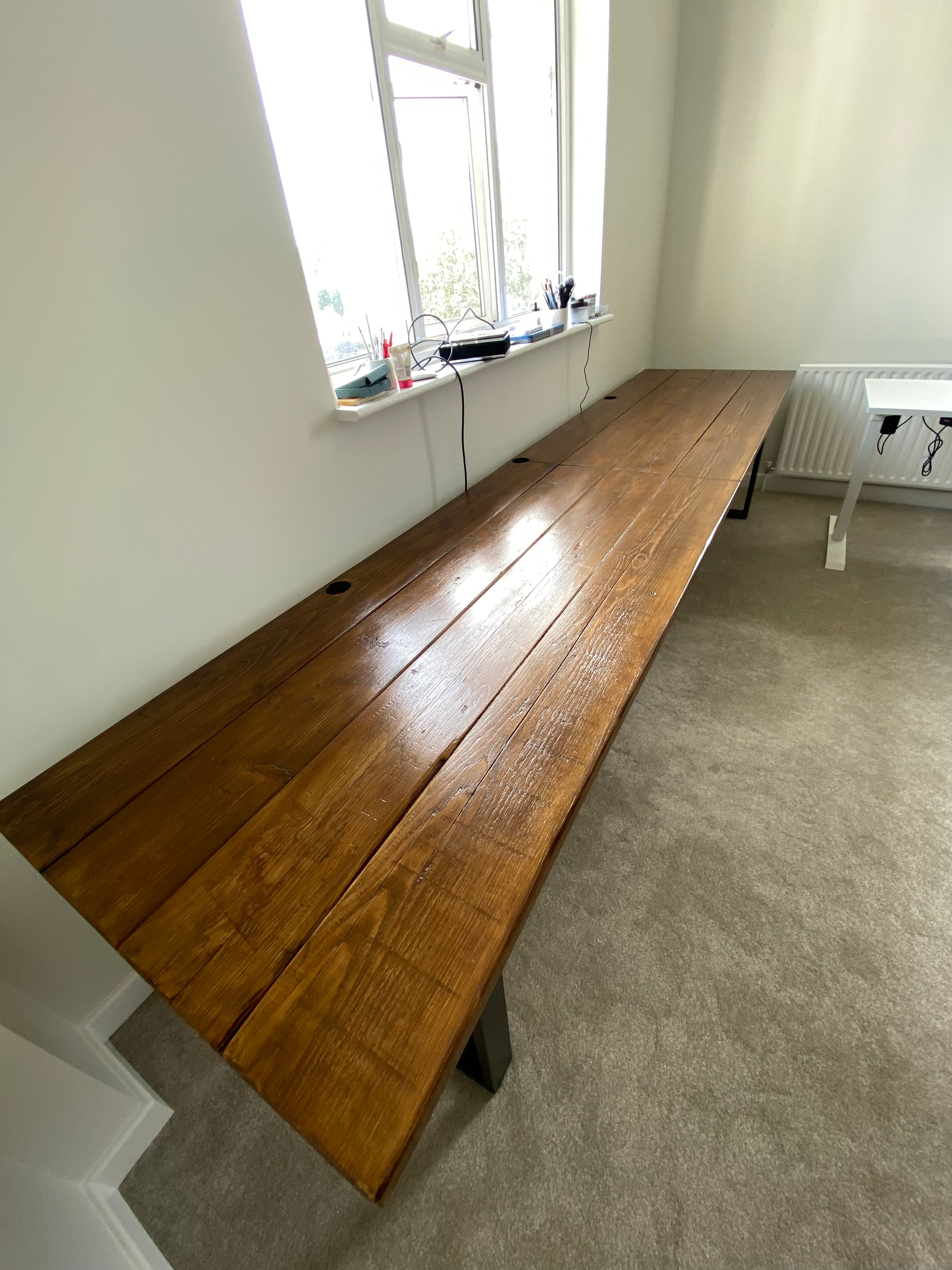 Handmade industrial desk made from reclaimed scaffold boards with steel legs – rustic wood workstation for home office or computer use.