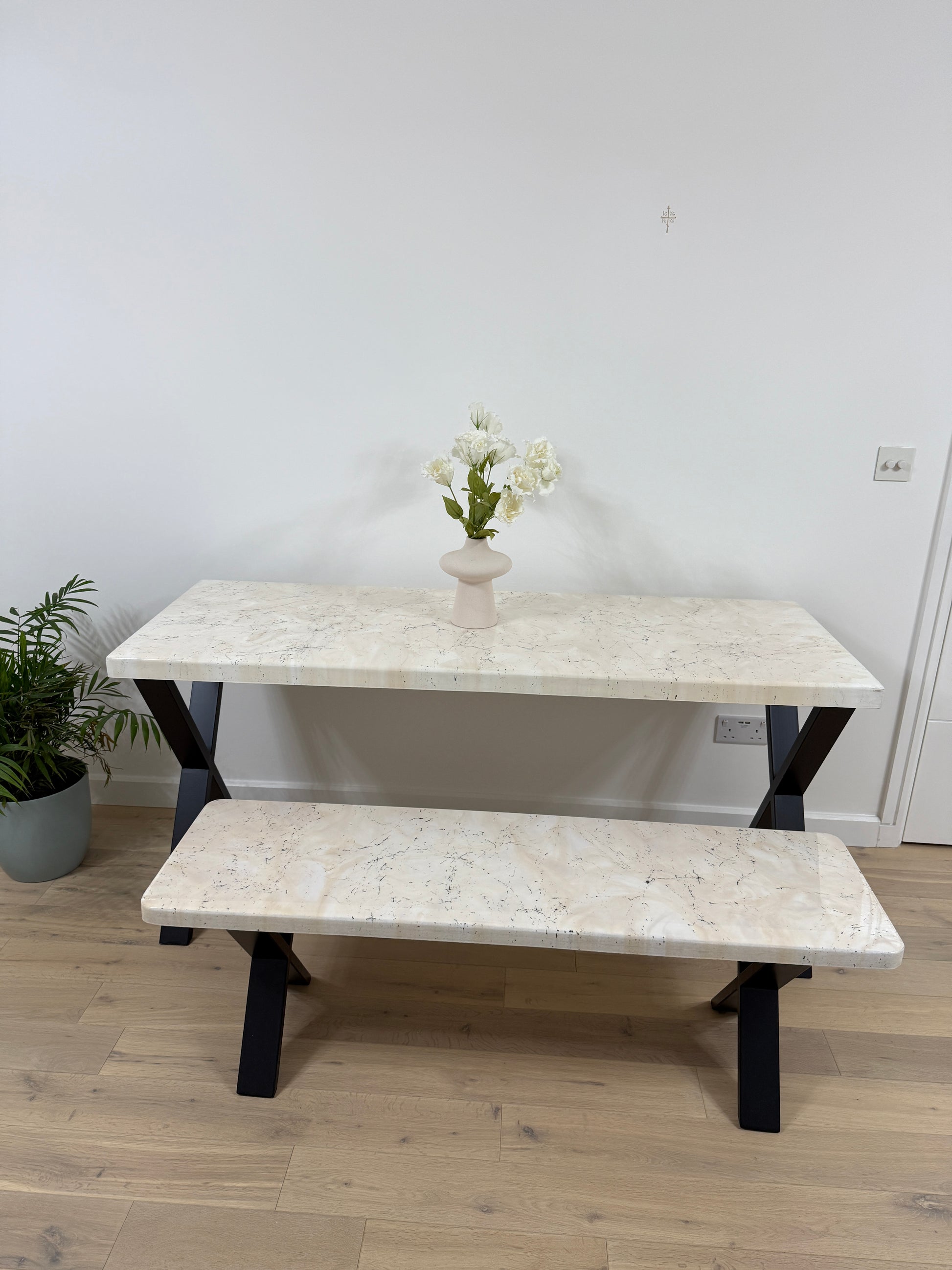 Handmade epoxy resin dining table with artistic marble effect top and custom metal legs – made to order in the UK, optional matching benches available.